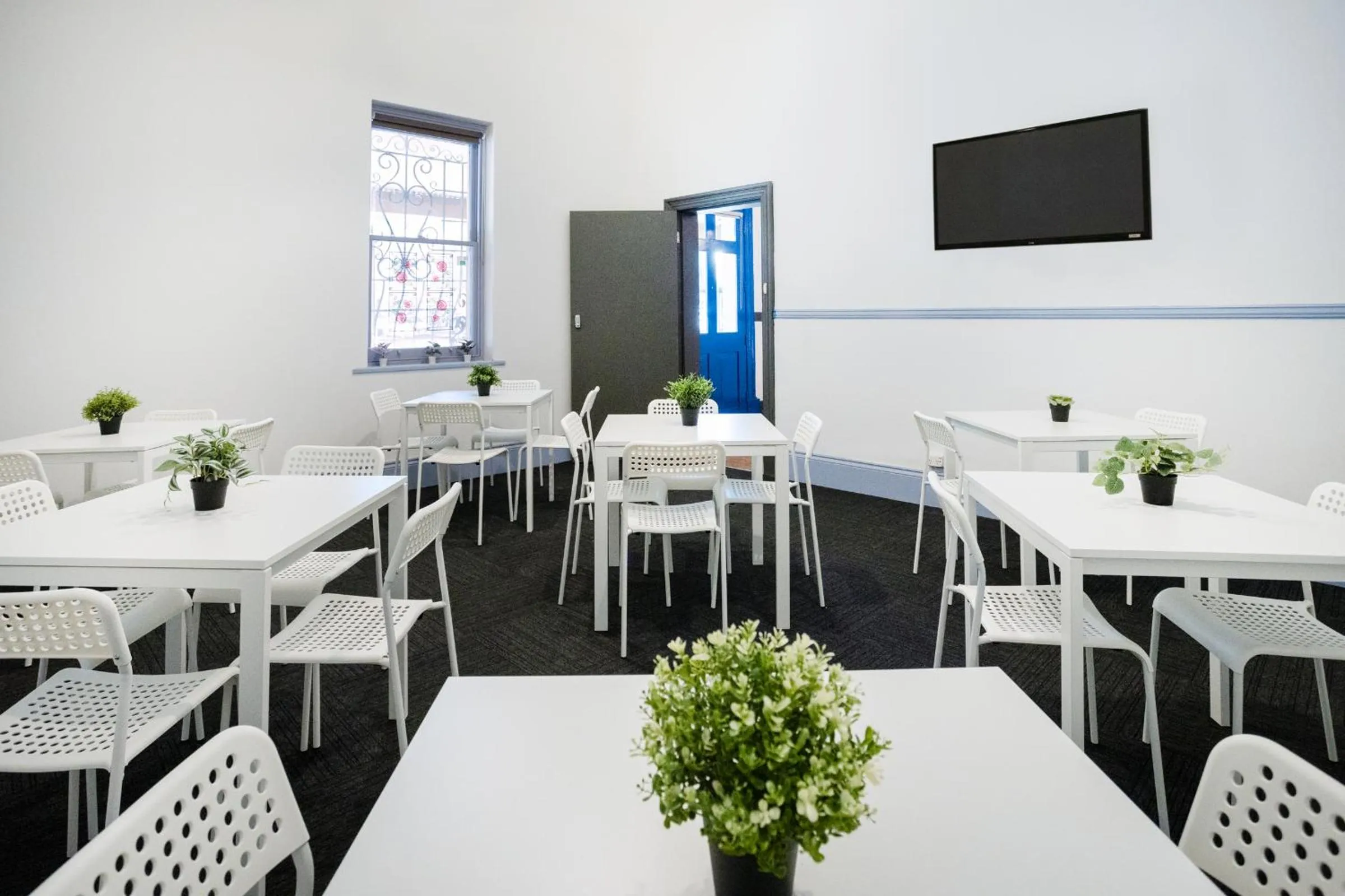 Communal lounge/ TV room in Base Camp Hostel