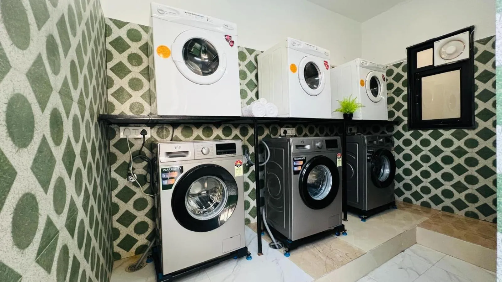 washing machine in ZEN Medicity - Hotel & Serviced Apartments Gurgaon