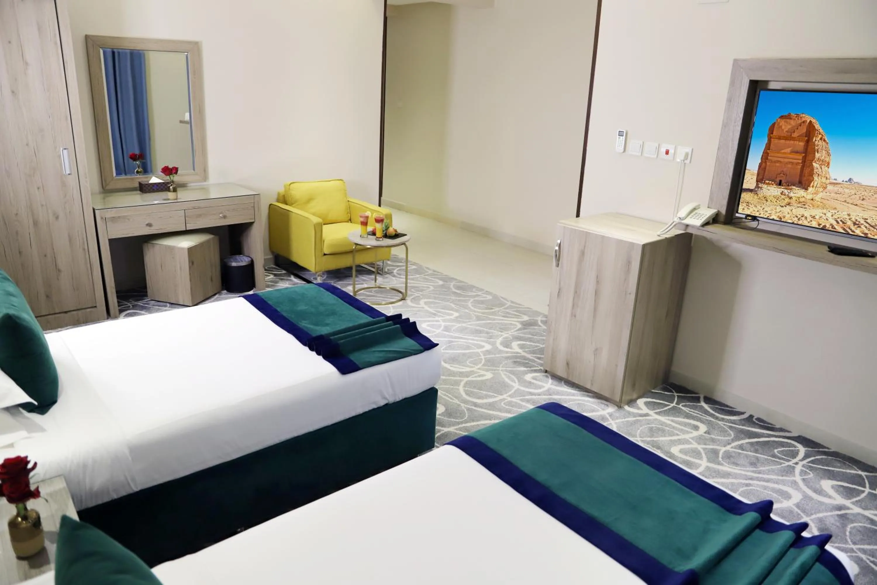 Bed in Sunrise Suites