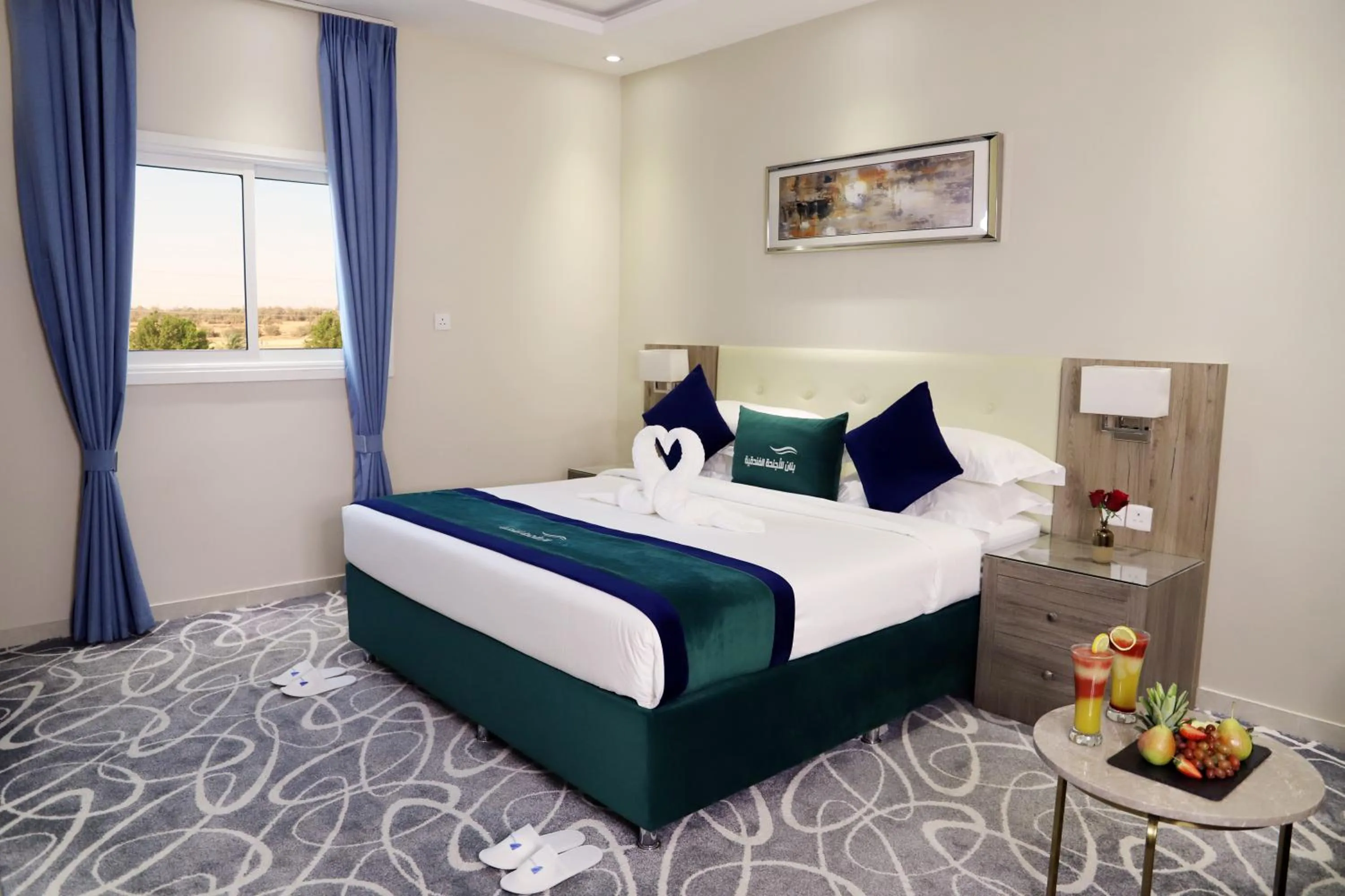 Bed in Sunrise Suites