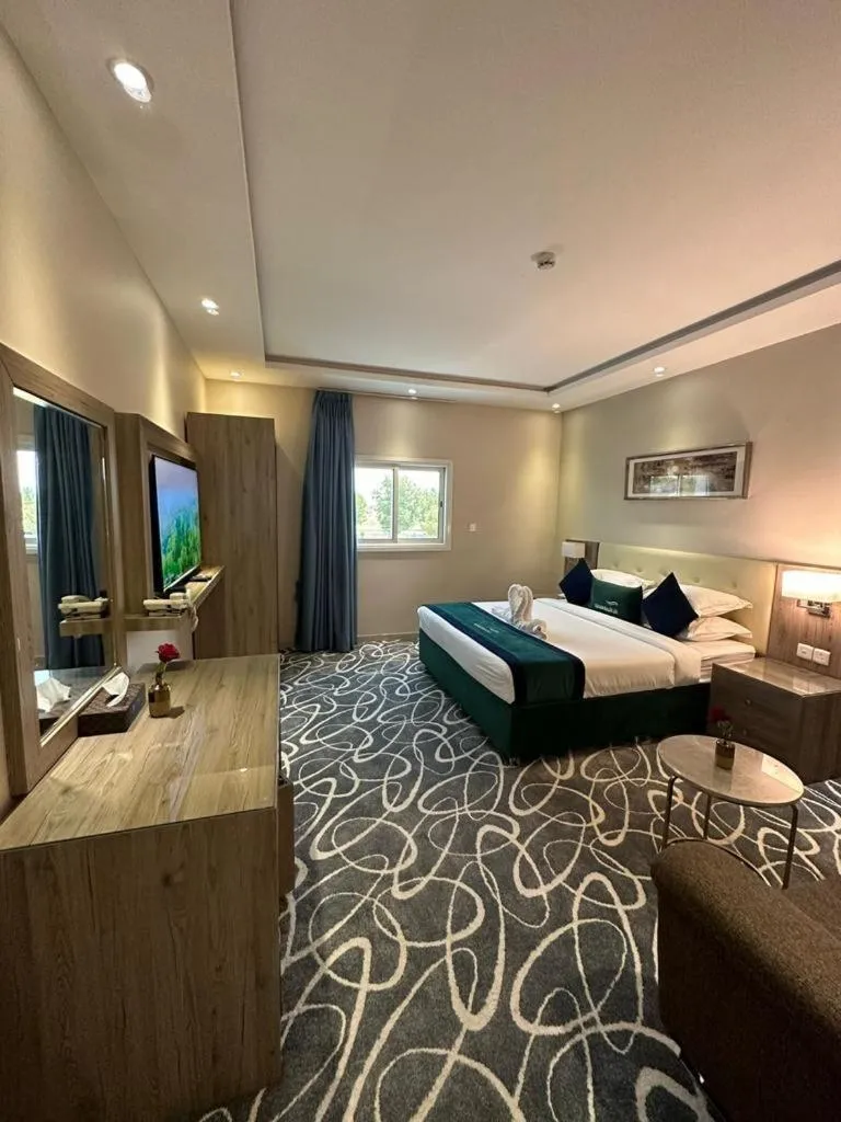 Bed in Sunrise Suites