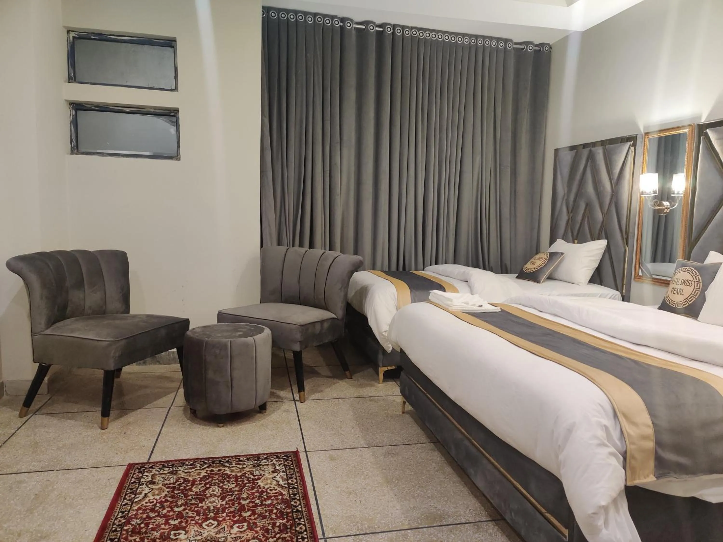 Bed in Hotel Swiss Pearl