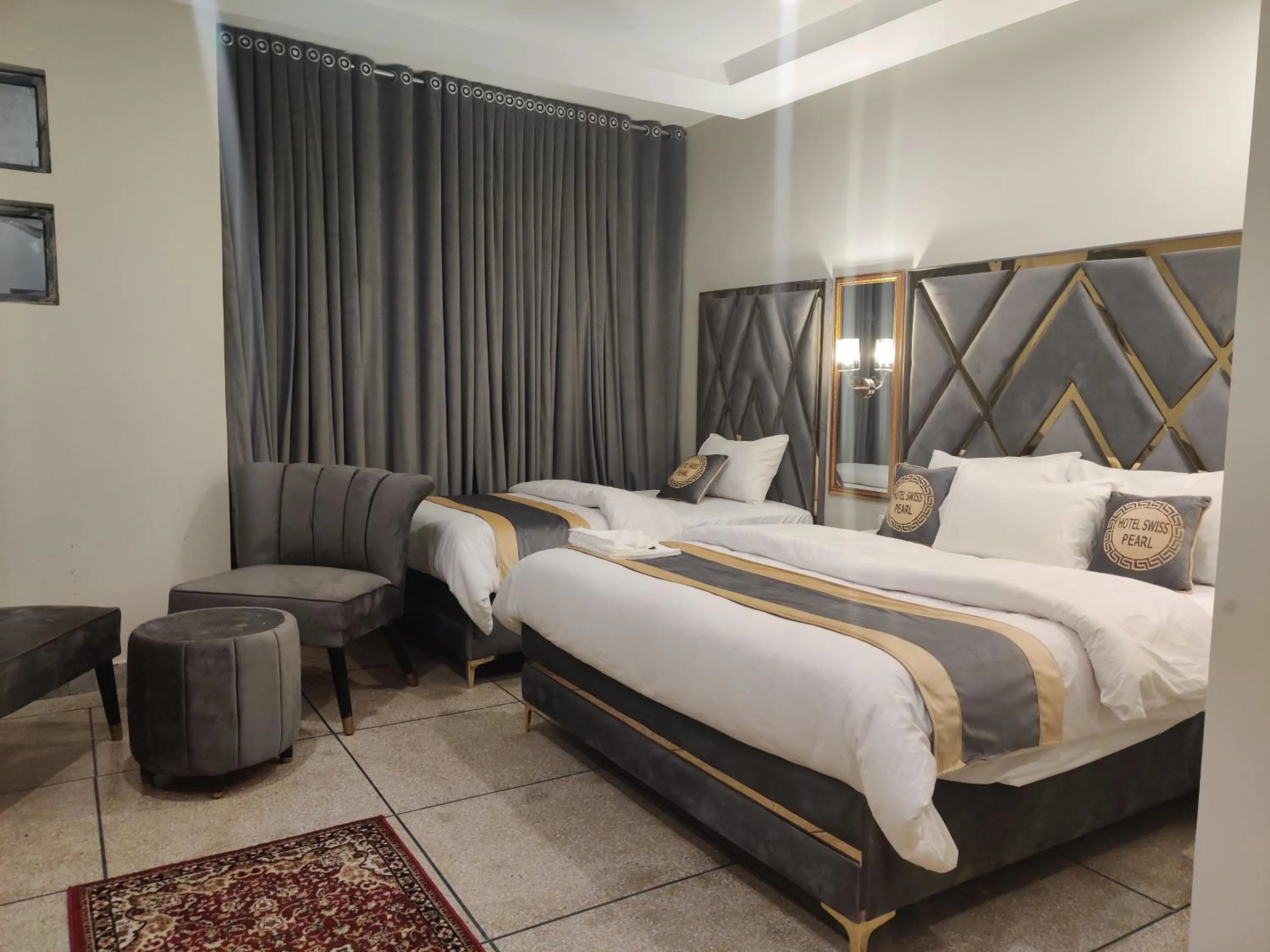Bed in Hotel Swiss Pearl