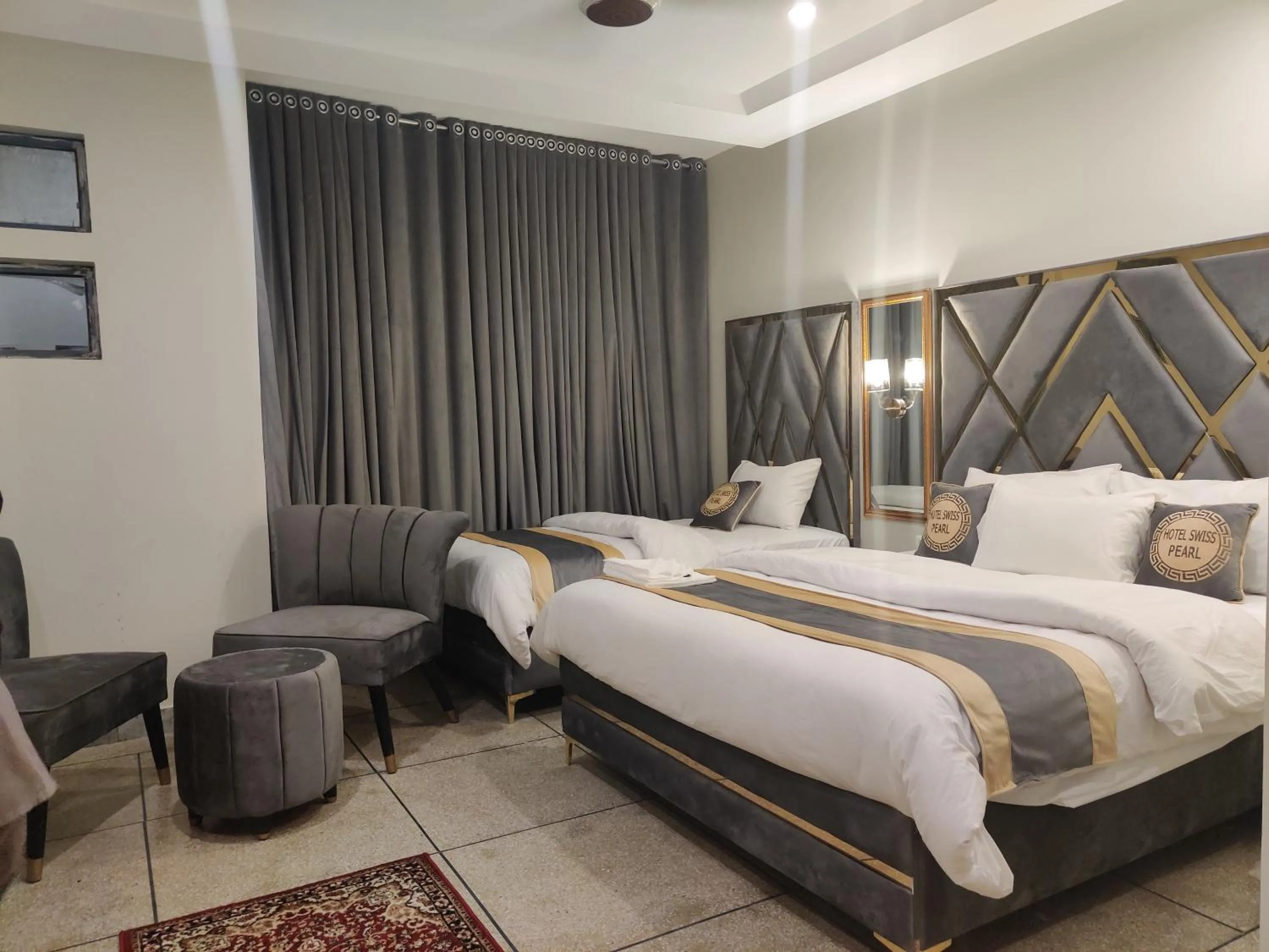 Bed in Hotel Swiss Pearl