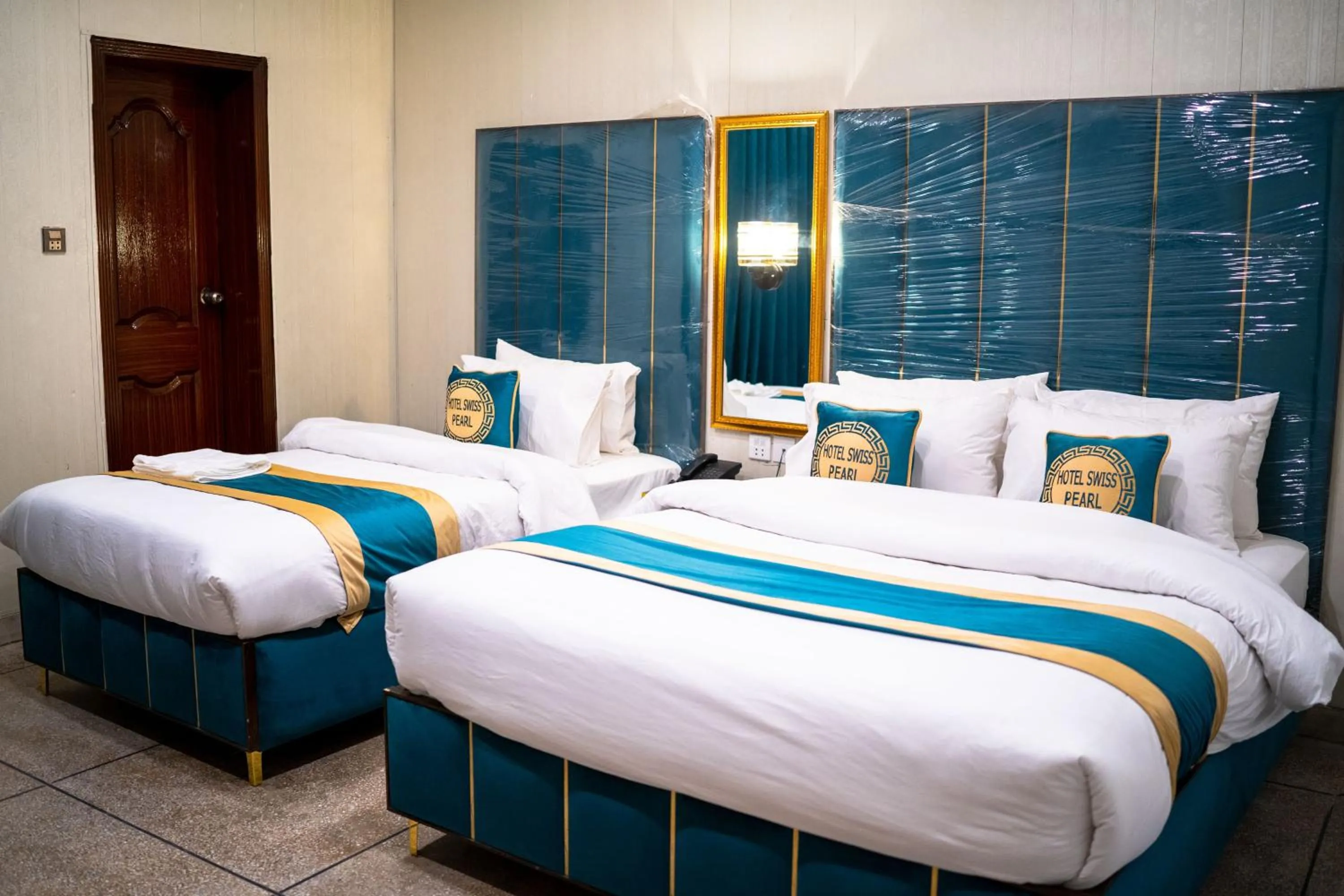 Bed in Hotel Swiss Pearl