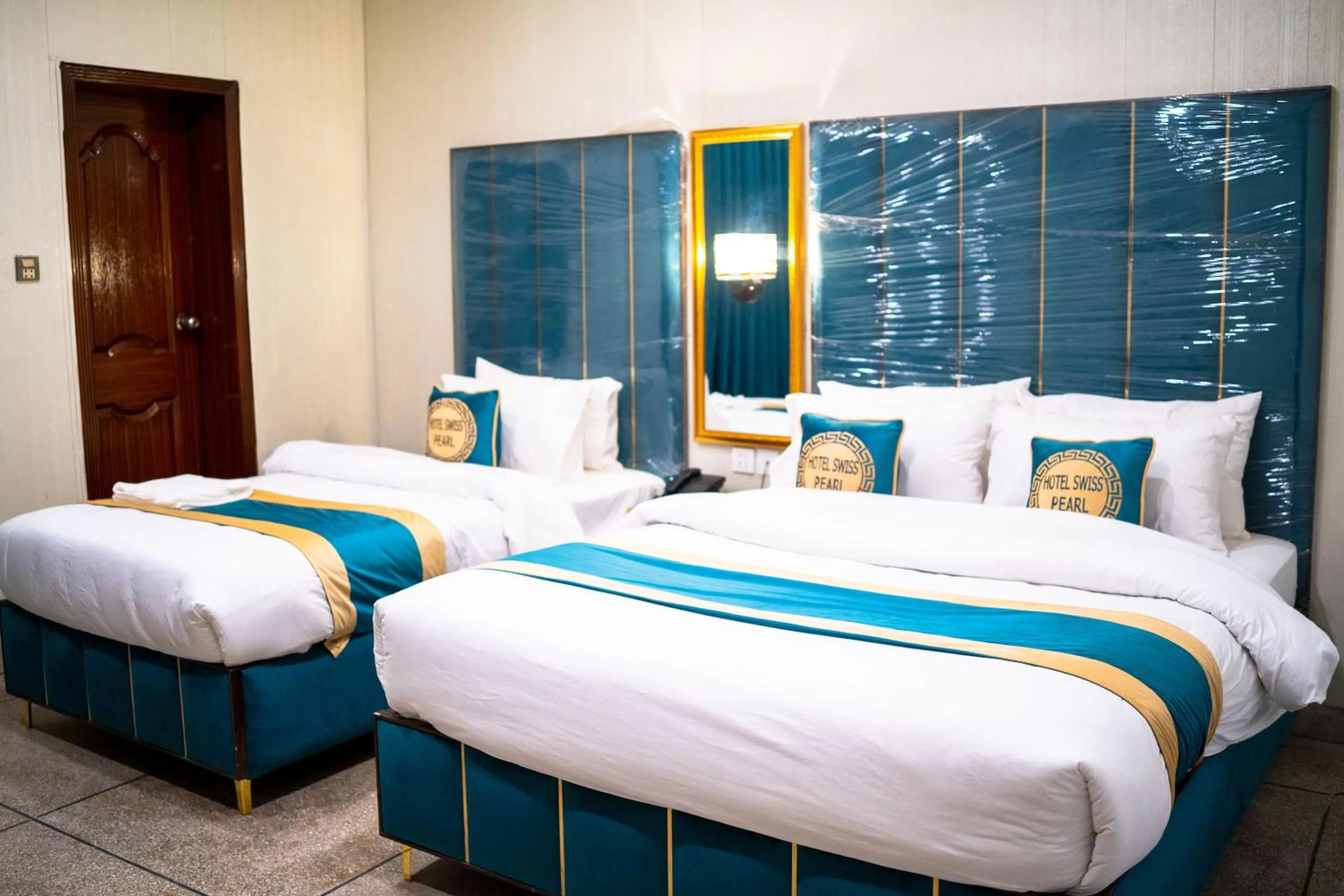 Bed in Hotel Swiss Pearl