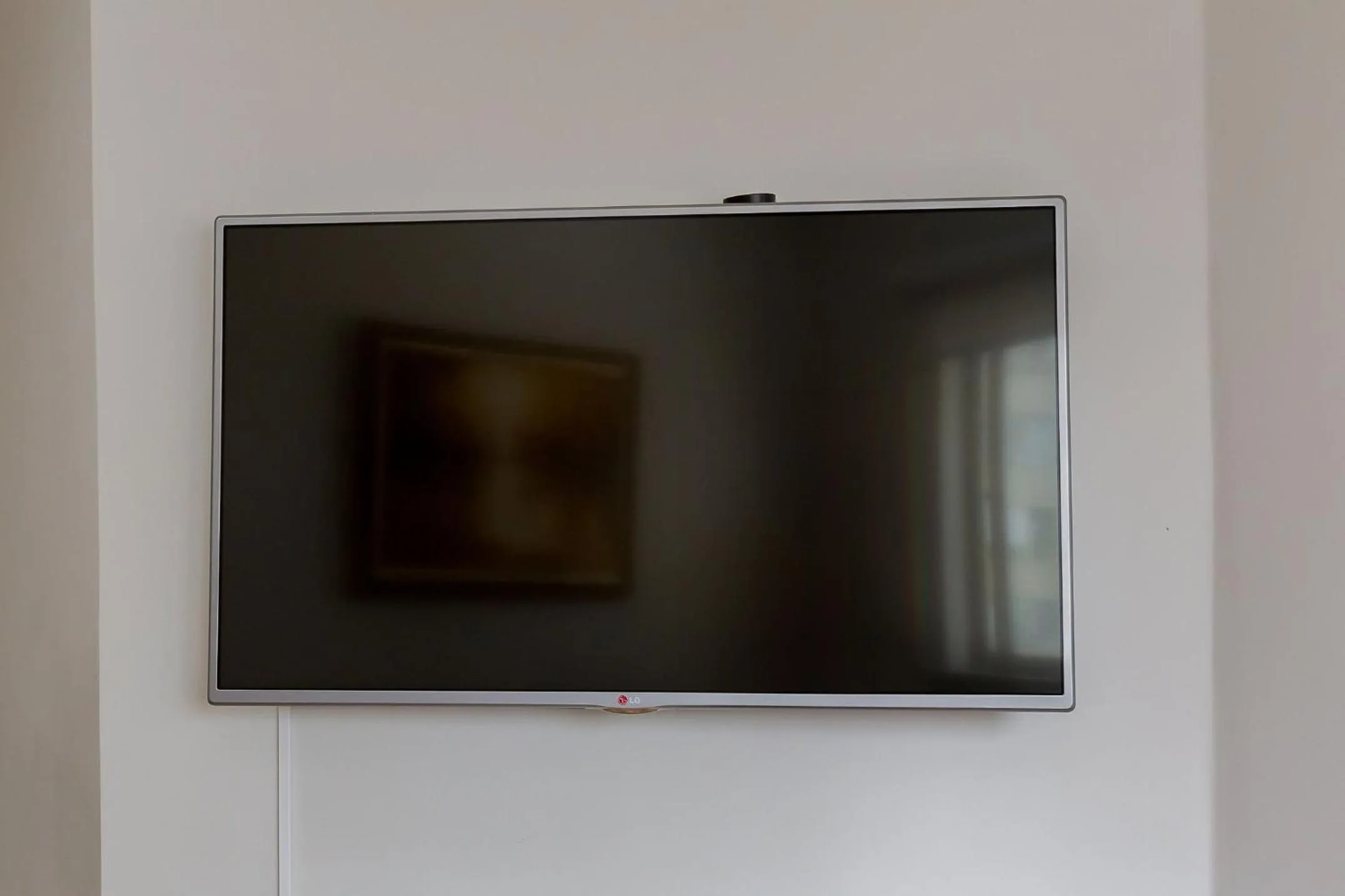 Living room in Ed. Charlie Chaplin | Prédio no coração de Curitiba | Gonzaga Stays