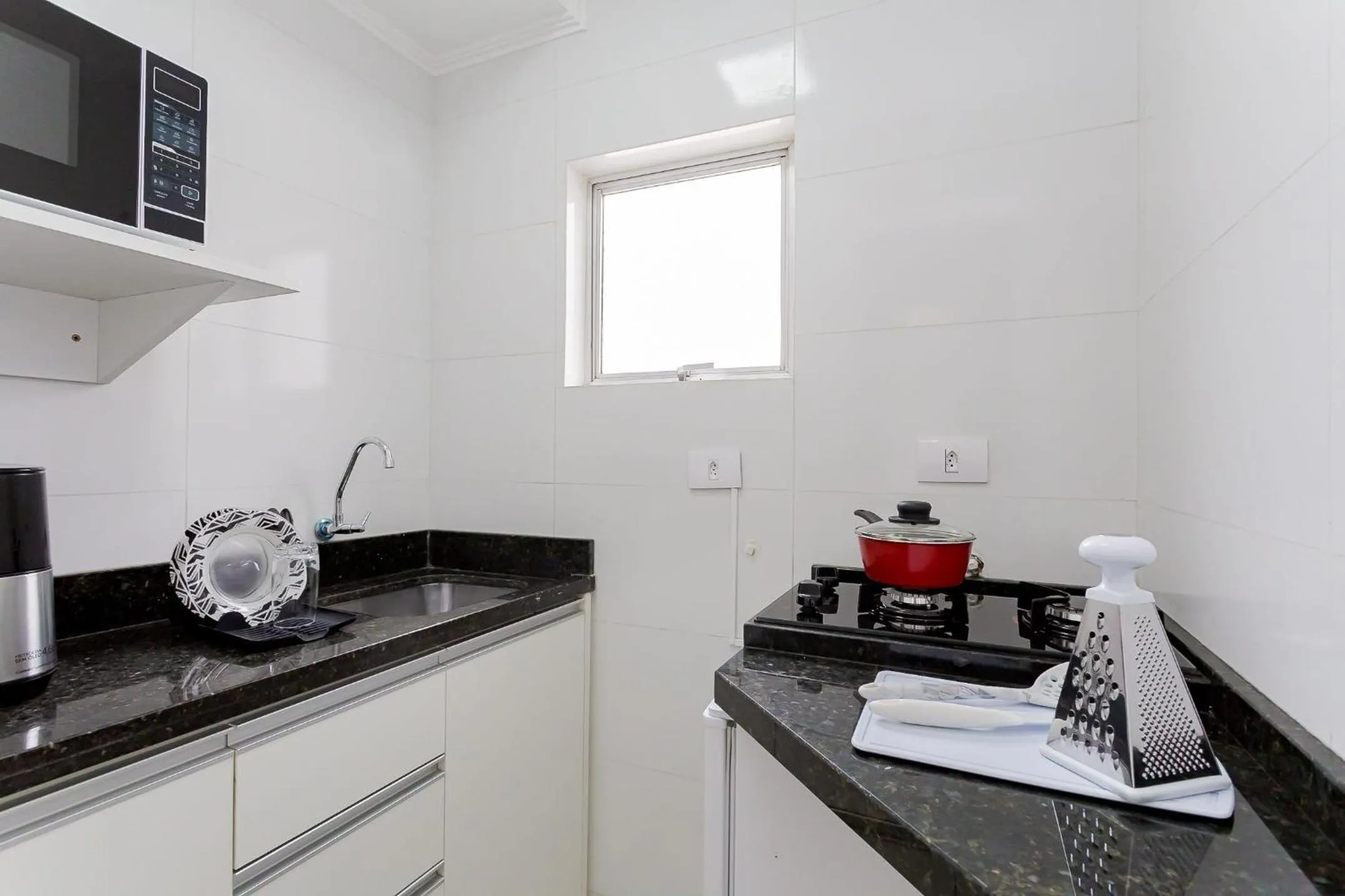 Kitchen or kitchenette in Ed. Charlie Chaplin | Prédio no coração de Curitiba | Gonzaga Stays