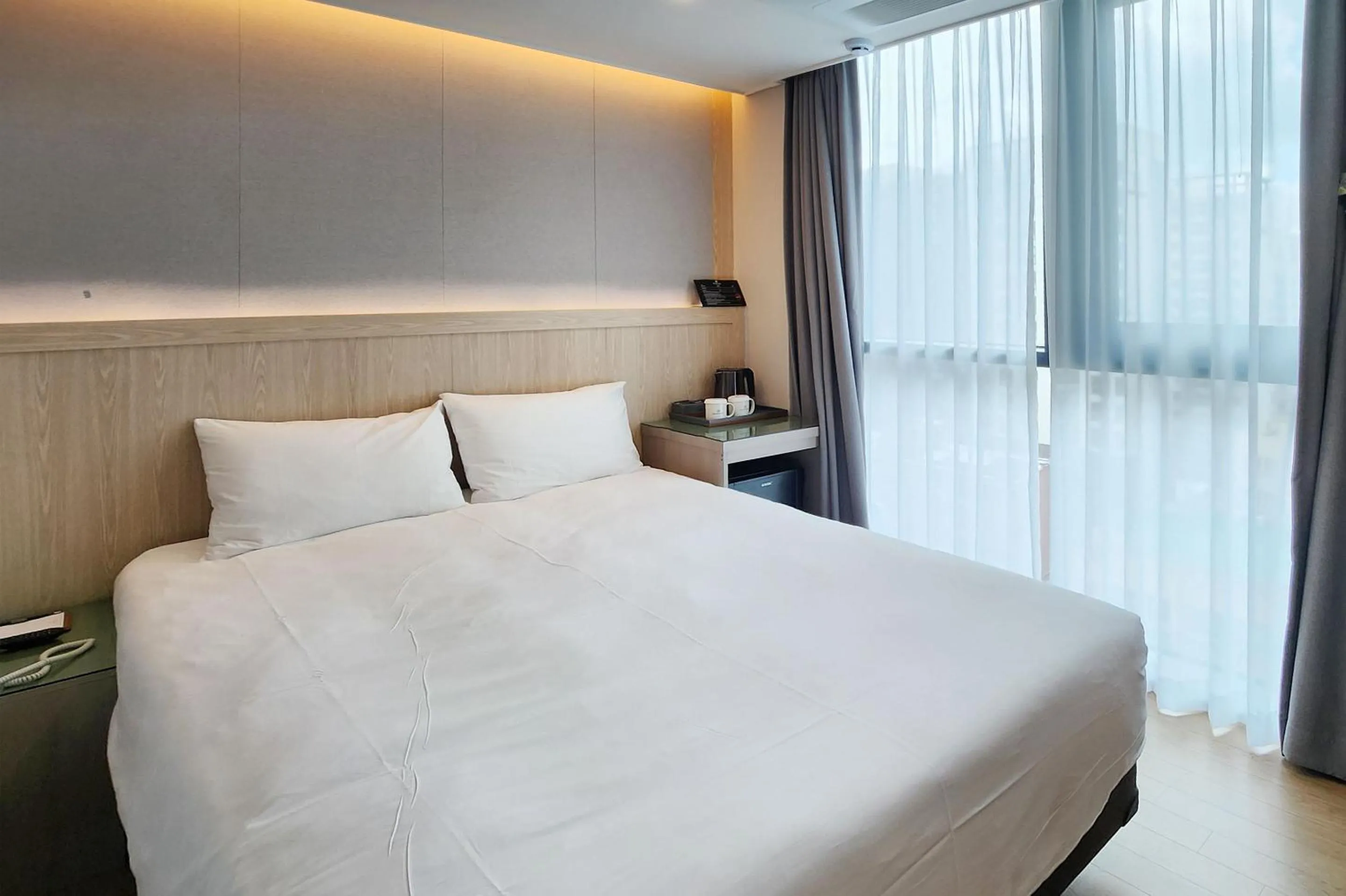 Bed in Jeju Bolton Hotel