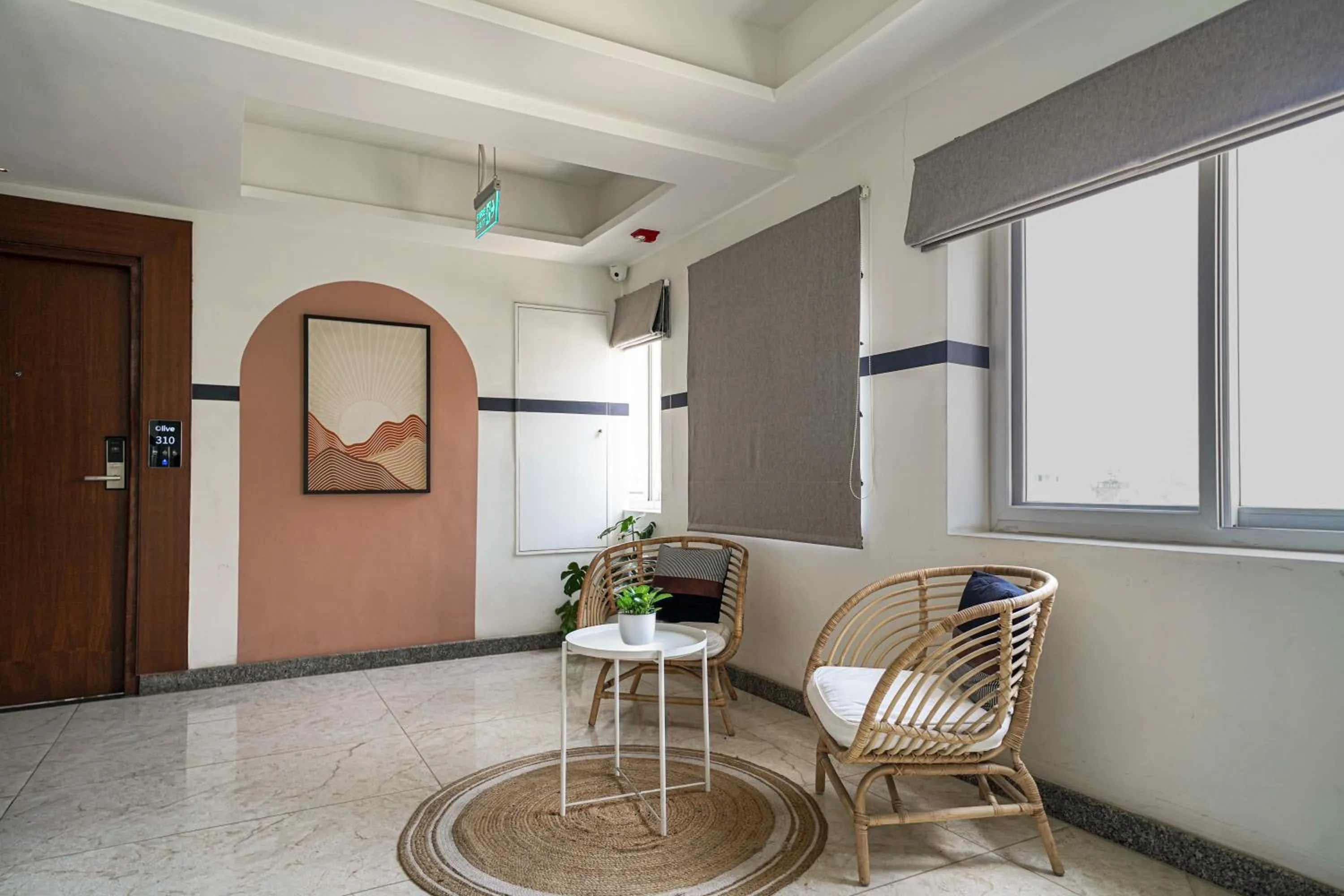 Seating area in Olive Hotel Hebbal by Embassy Group