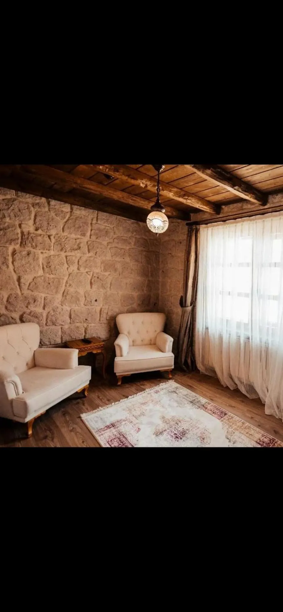 Seating area, Bed in ELEVRES STONE HOUSE HOTEL