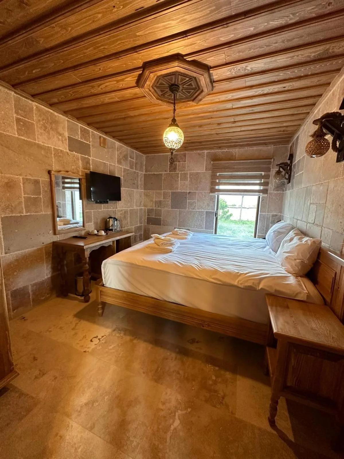 Bed in ELEVRES STONE HOUSE HOTEL