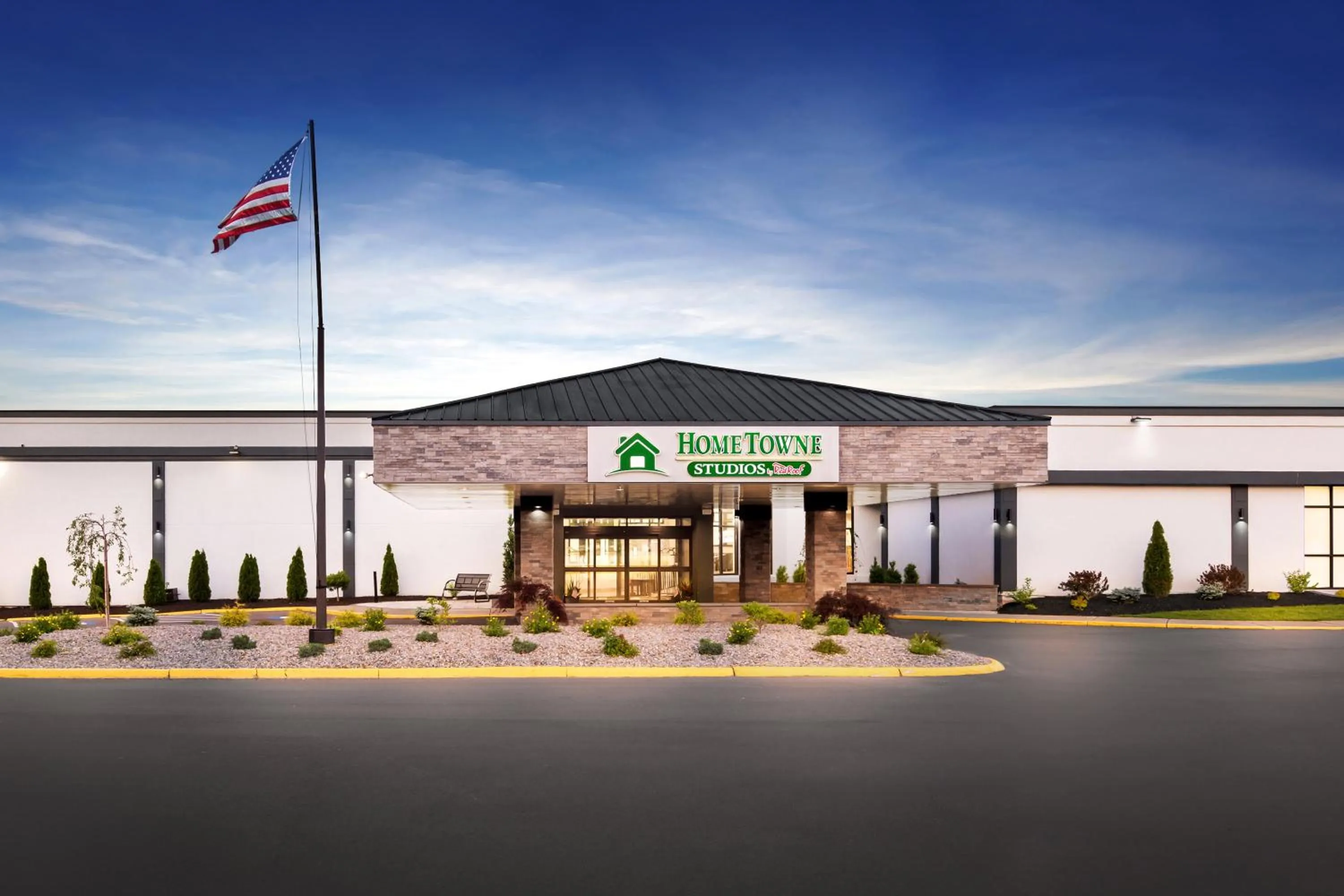 Property building in HomeTowne Studios by Red Roof & Conference Center Cortland