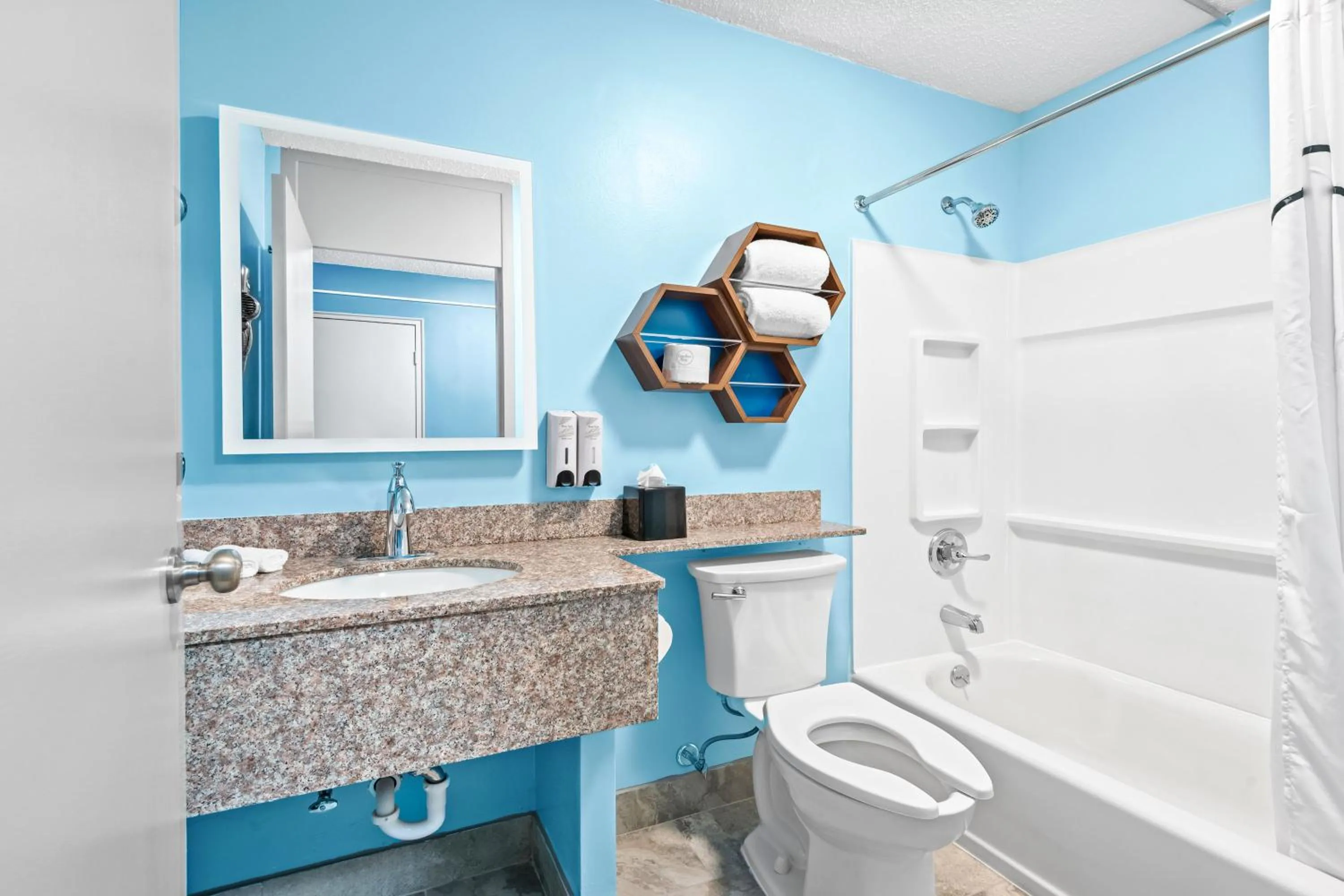 Bathroom in HomeTowne Studios by Red Roof & Conference Center Cortland