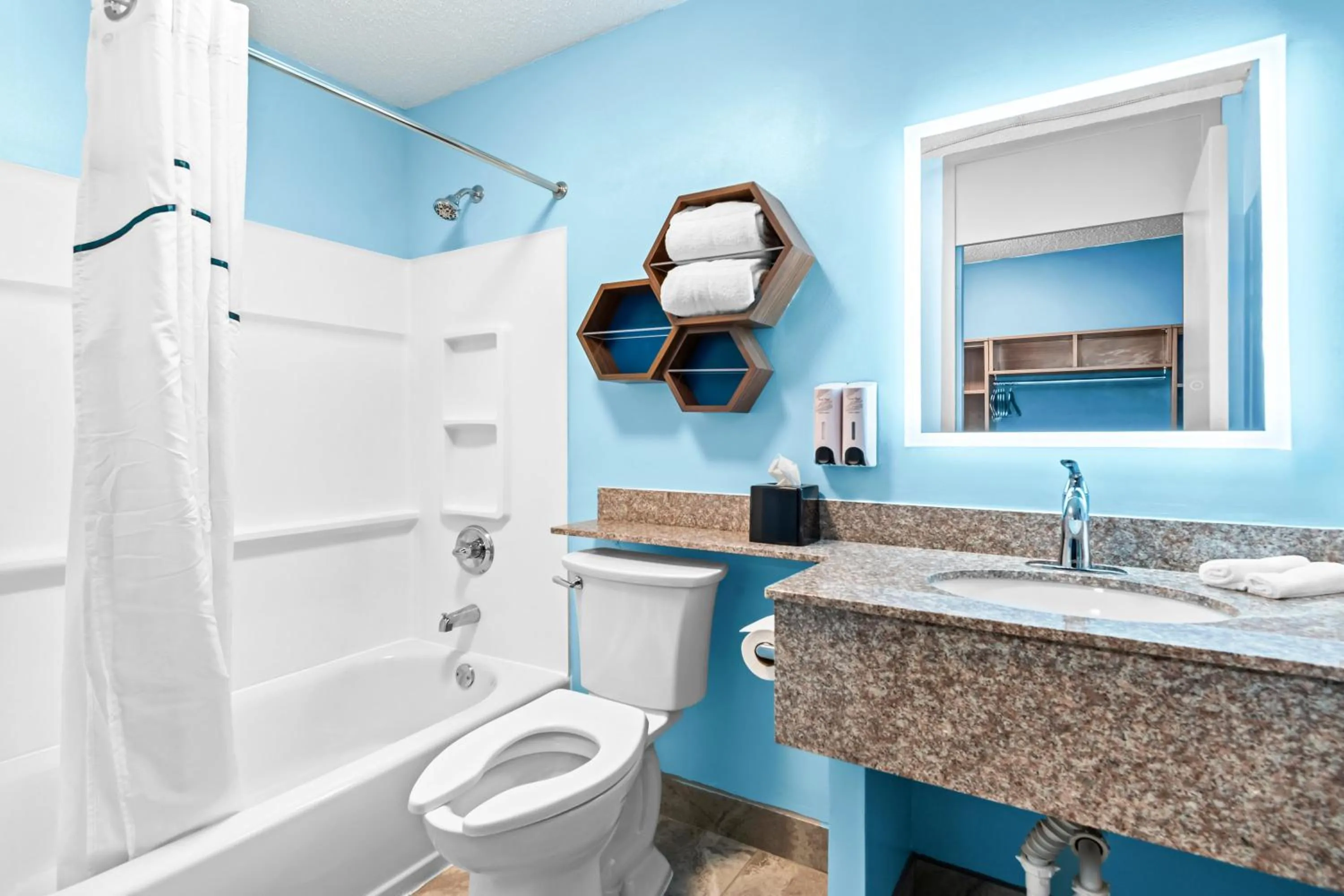 Bathroom in HomeTowne Studios by Red Roof & Conference Center Cortland