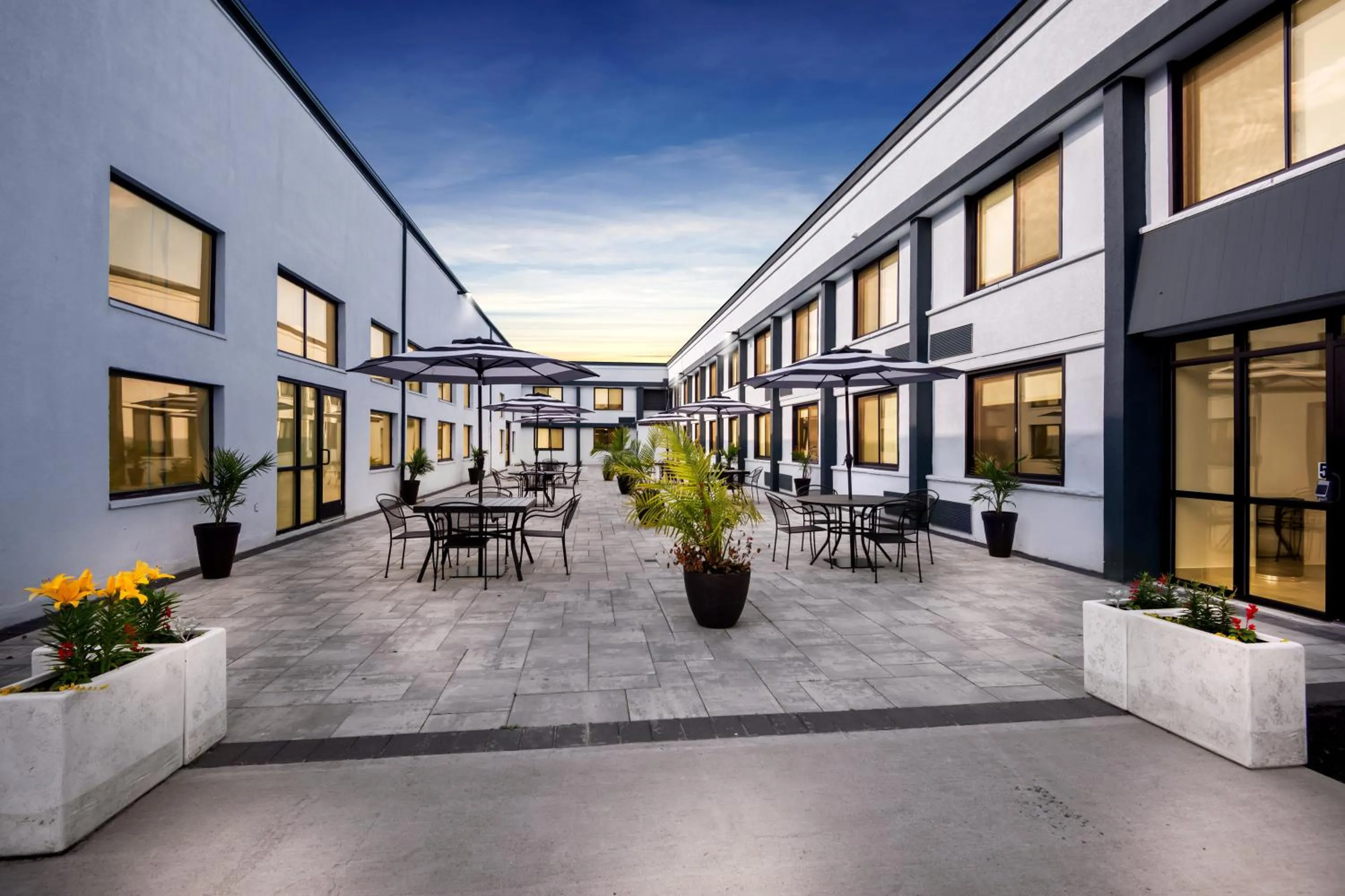 Property building in HomeTowne Studios by Red Roof & Conference Center Cortland