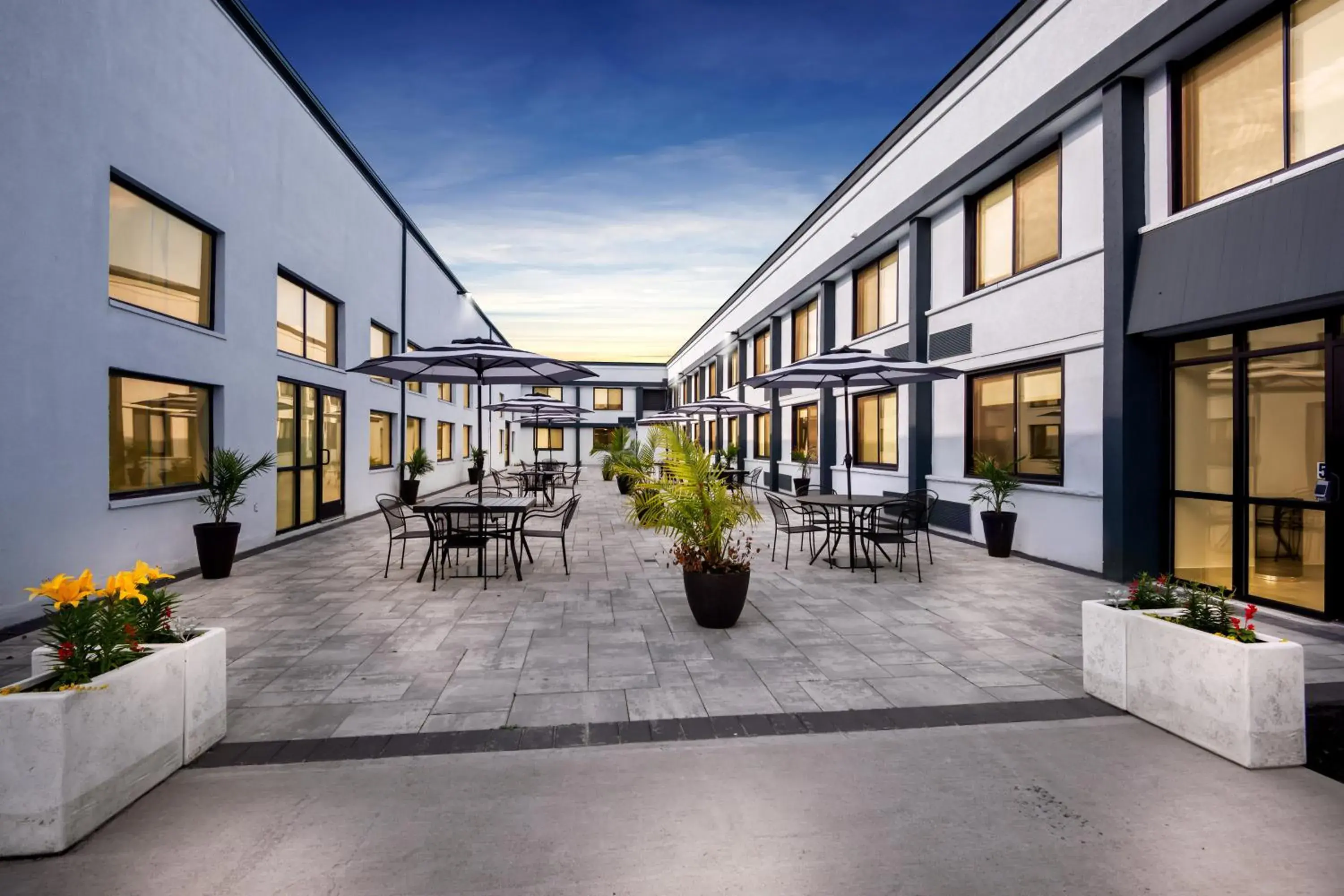 Property building in HomeTowne Studios by Red Roof & Conference Center Cortland Property building in HomeTowne Studios by Red Roof & Conference Center Cortland