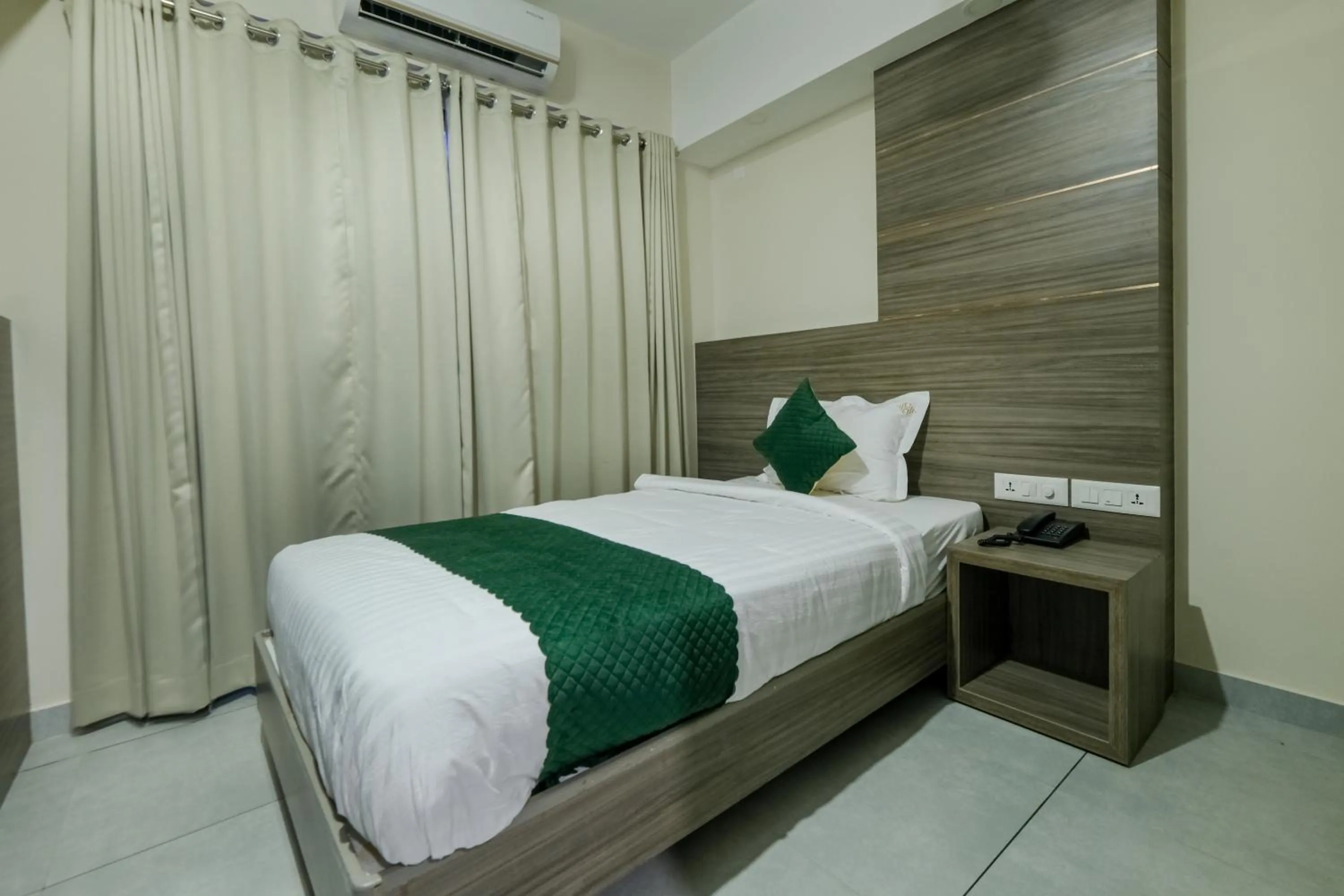 Bed in The Heartland Business Hotel