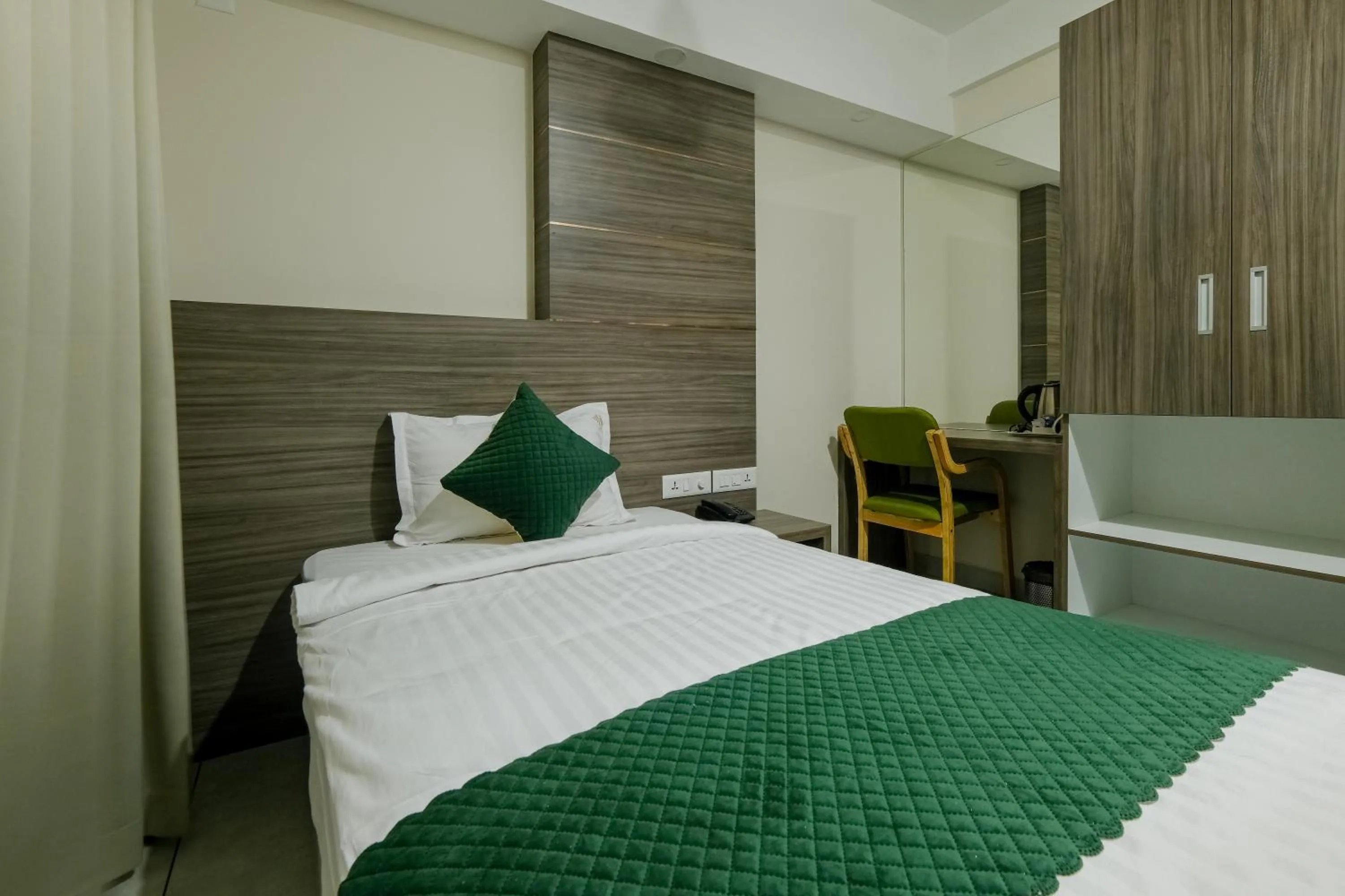 Bed in The Heartland Business Hotel