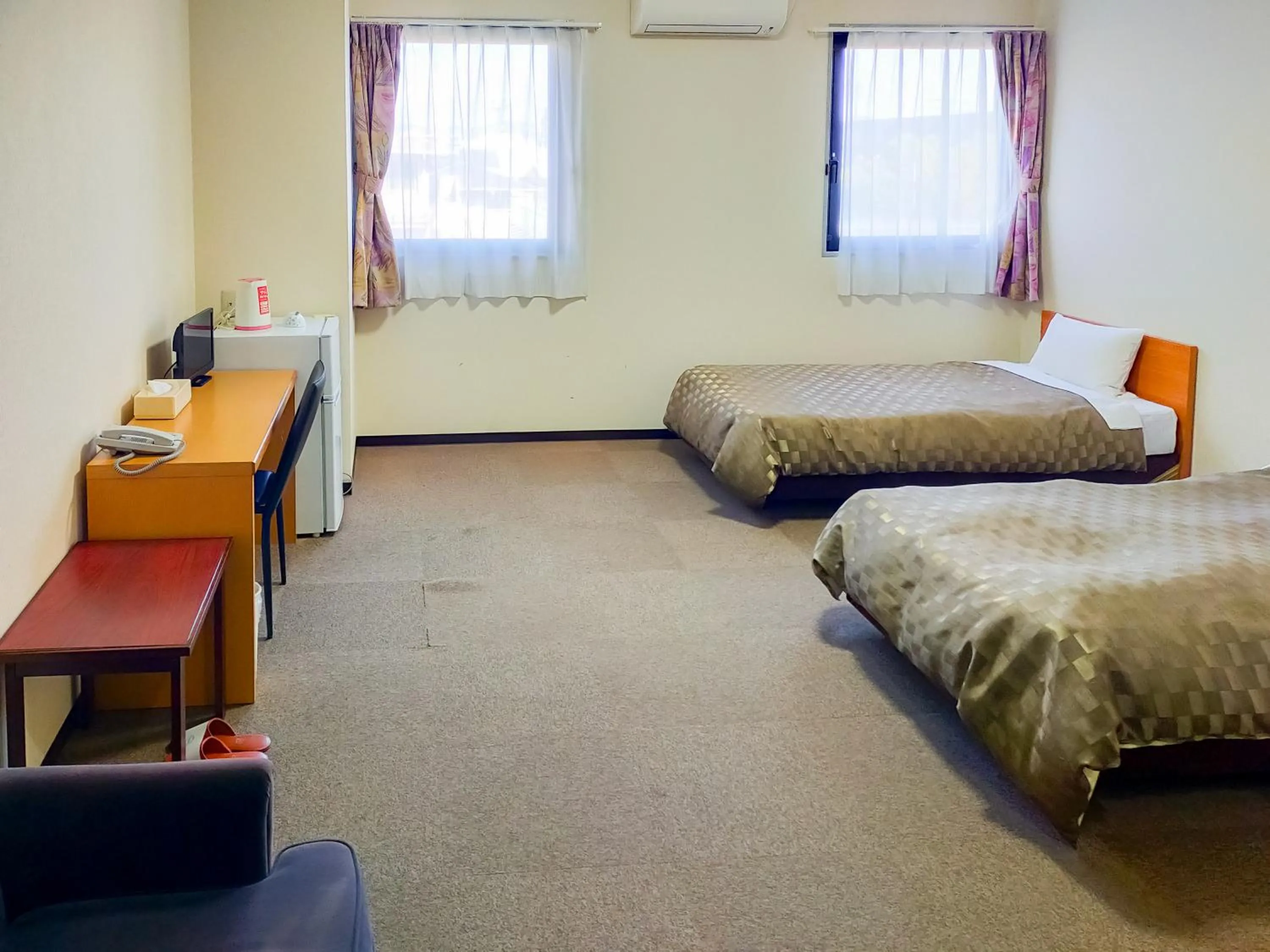 Bed in Hotel Kurashiki Mizushima Hills