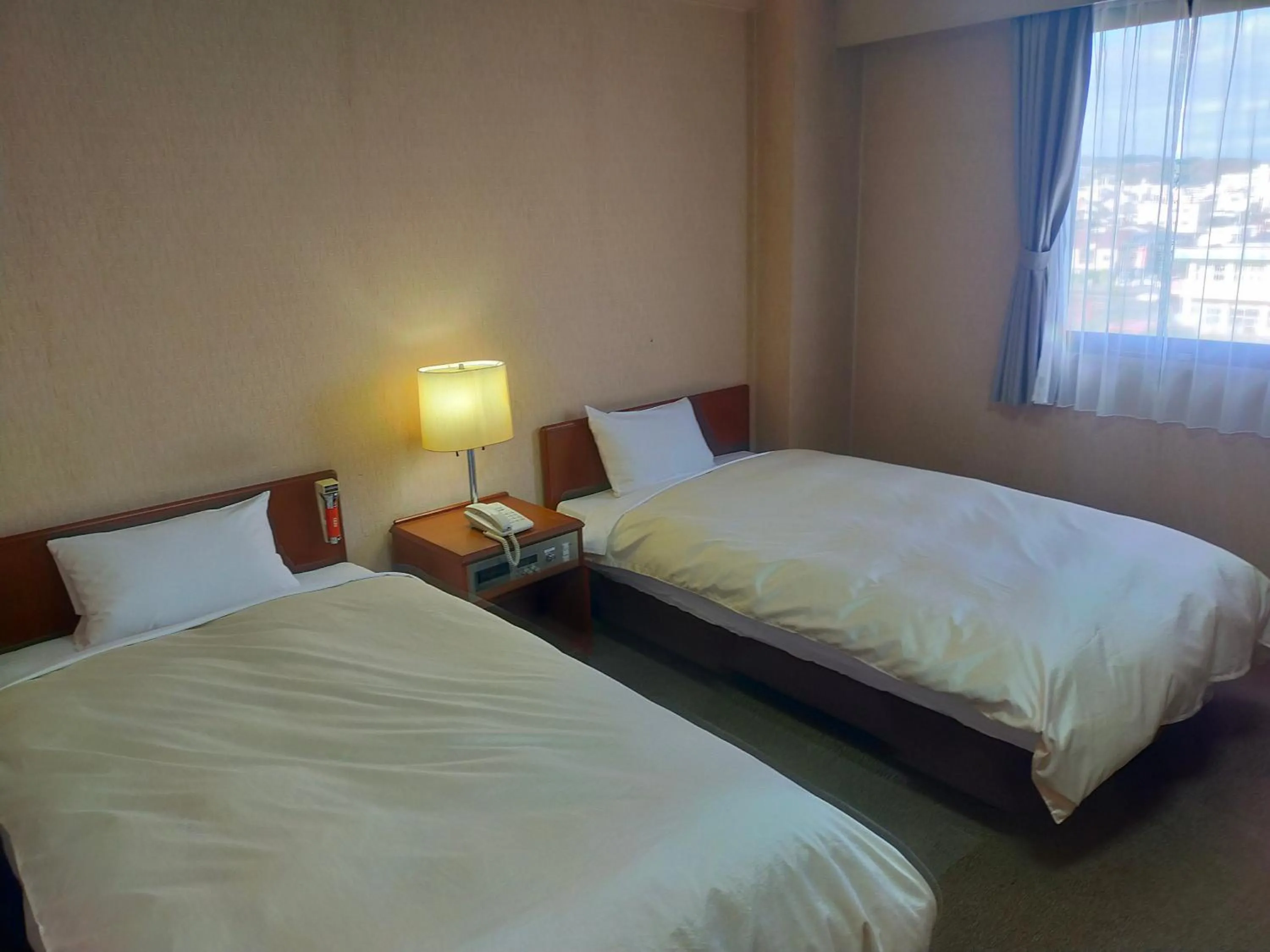 Bed in Hotel Kurashiki Mizushima Hills