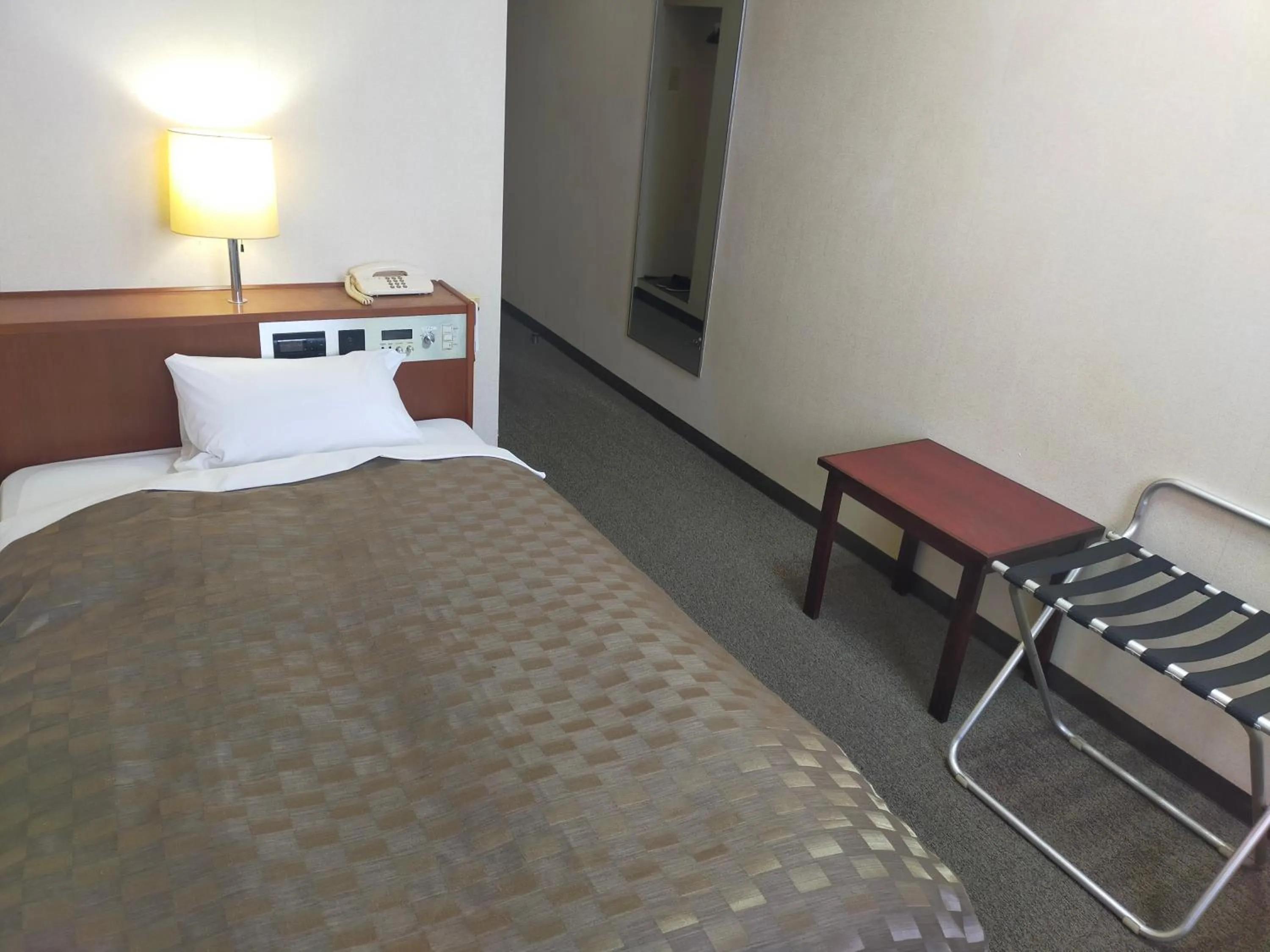 Bed in Hotel Kurashiki Mizushima Hills