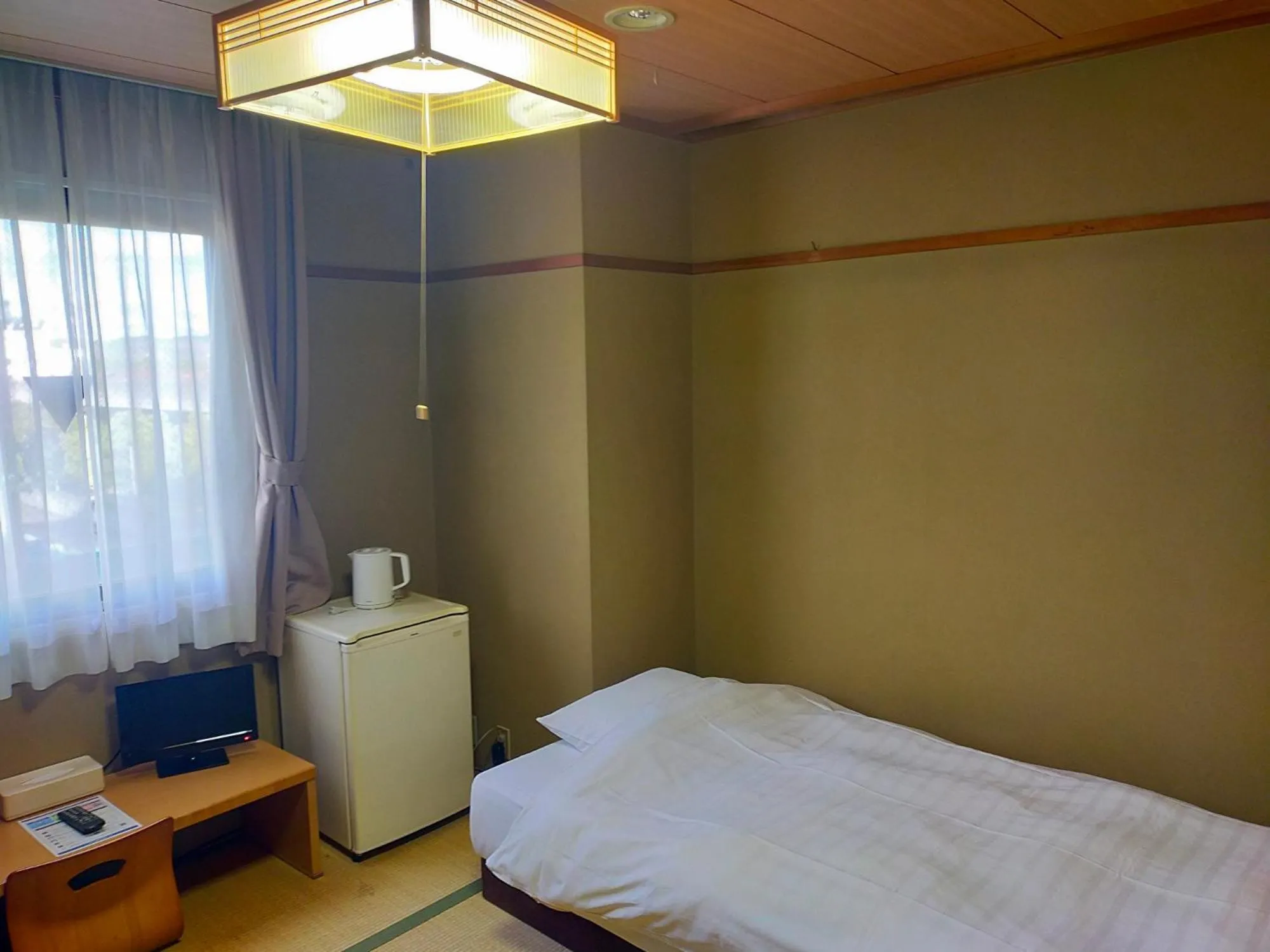Bed in Hotel Kurashiki Mizushima Hills