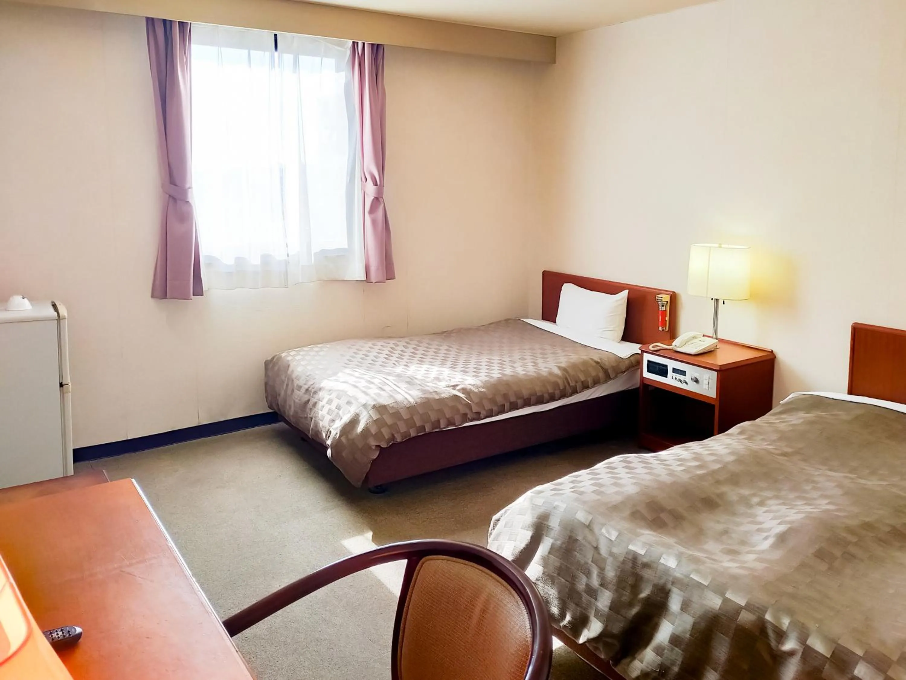 Bed in Hotel Kurashiki Mizushima Hills