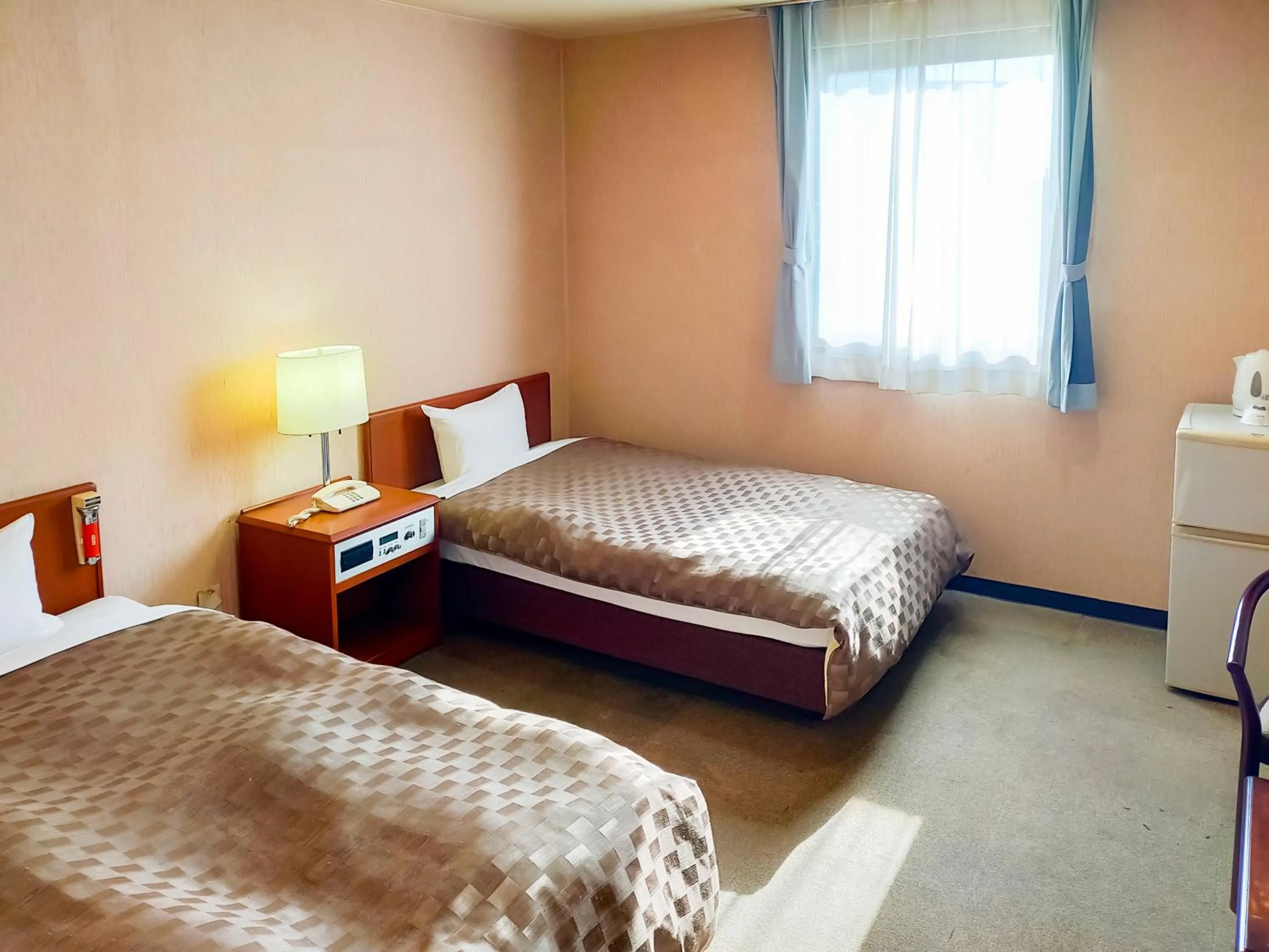 Bed in Hotel Kurashiki Mizushima Hills