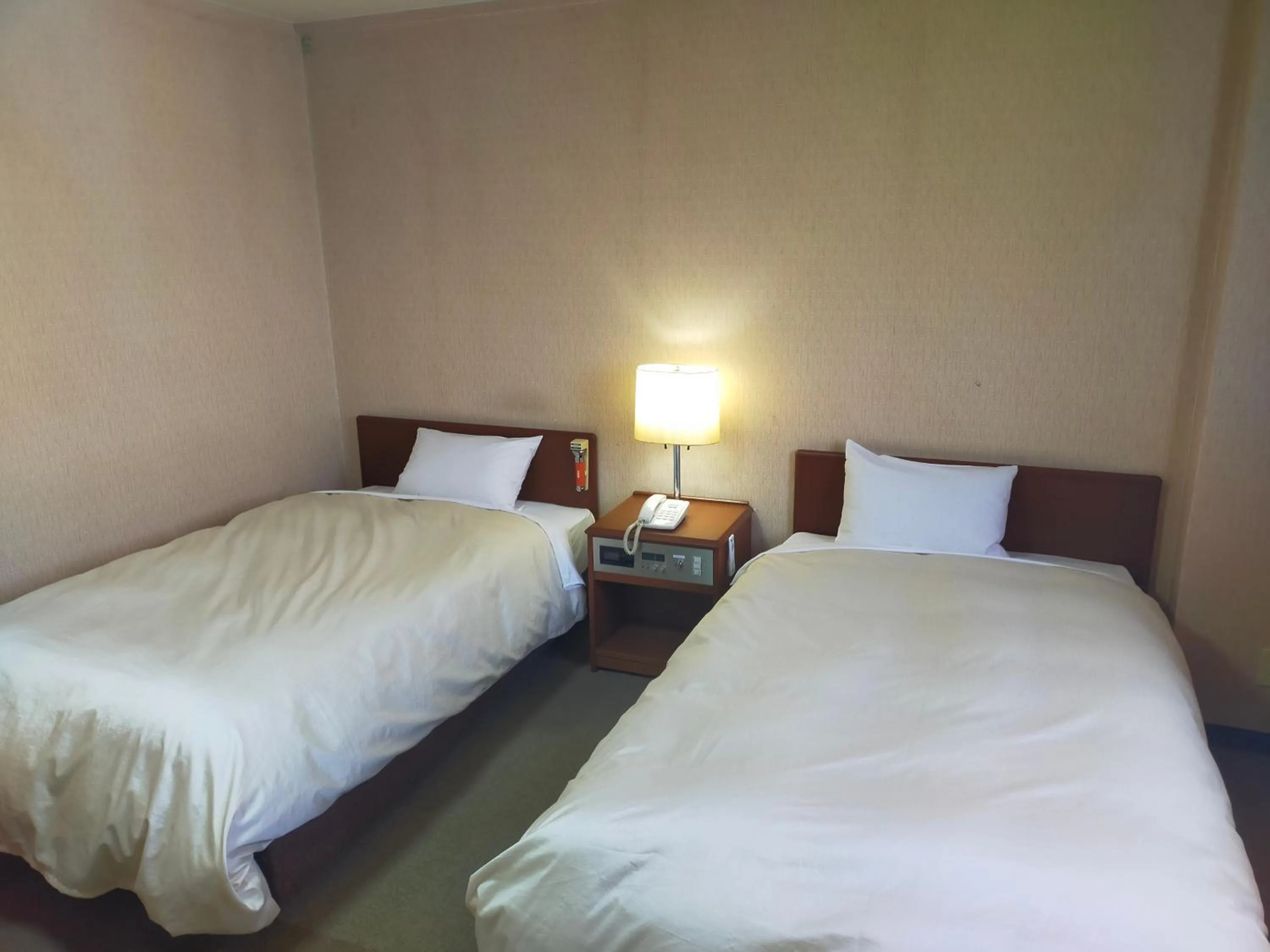 Bed in Hotel Kurashiki Mizushima Hills