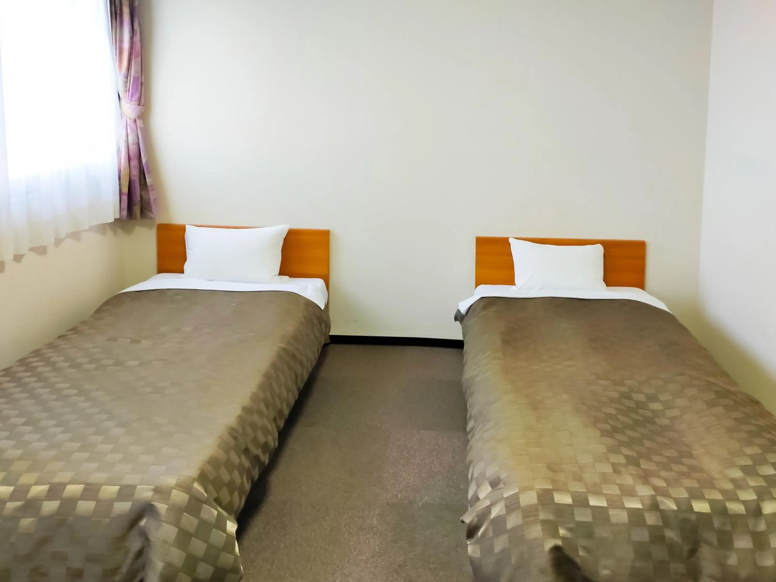Bed in Hotel Kurashiki Mizushima Hills