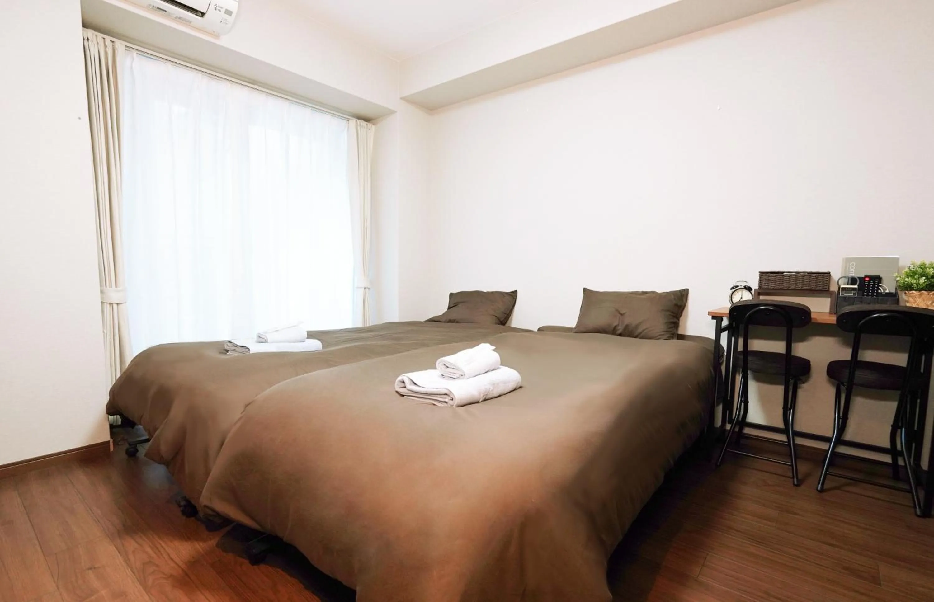 Bed in nestay apartment osaka ebisu