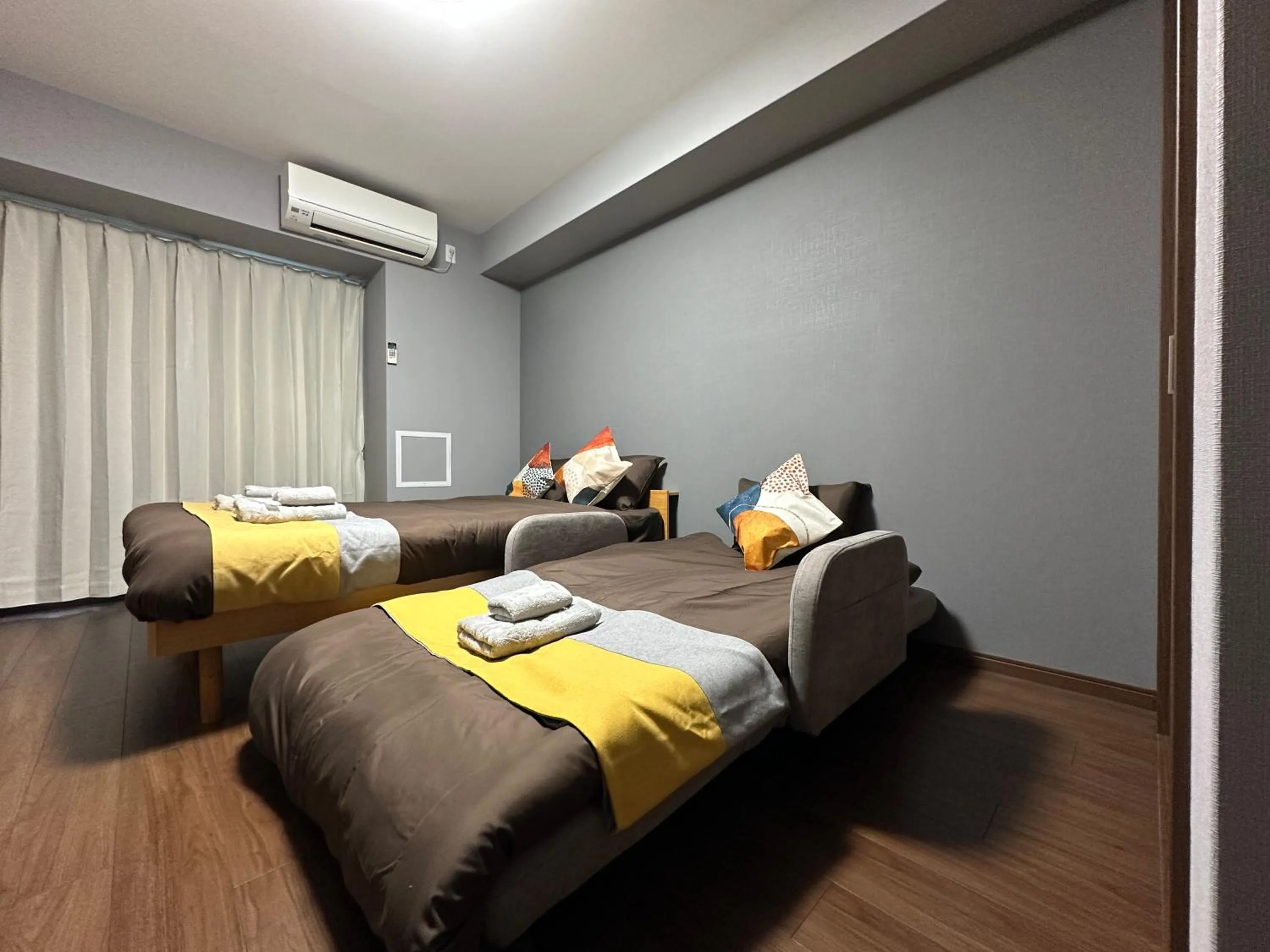 Bed in nestay apartment osaka ebisu