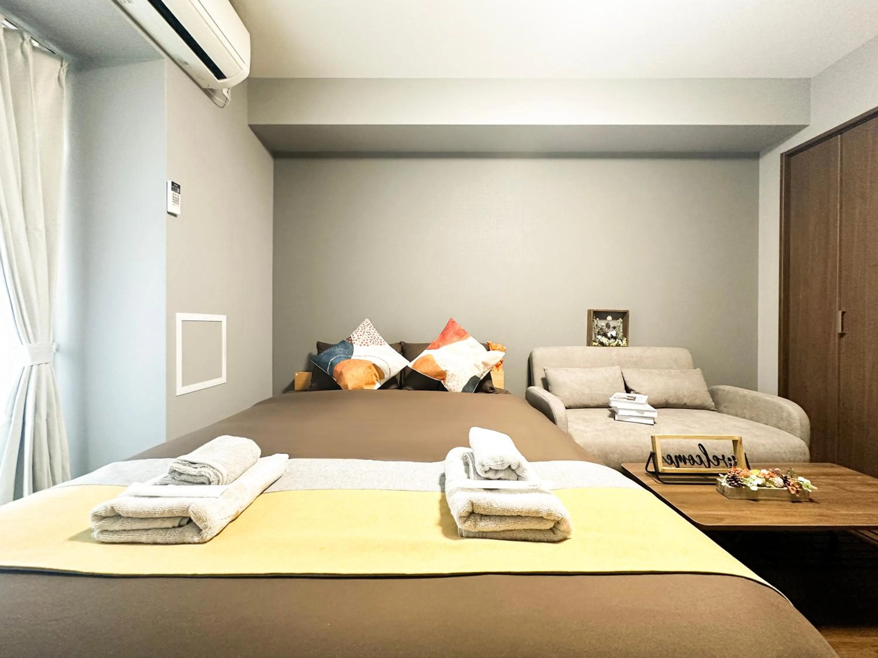 Bed in nestay apartment osaka ebisu