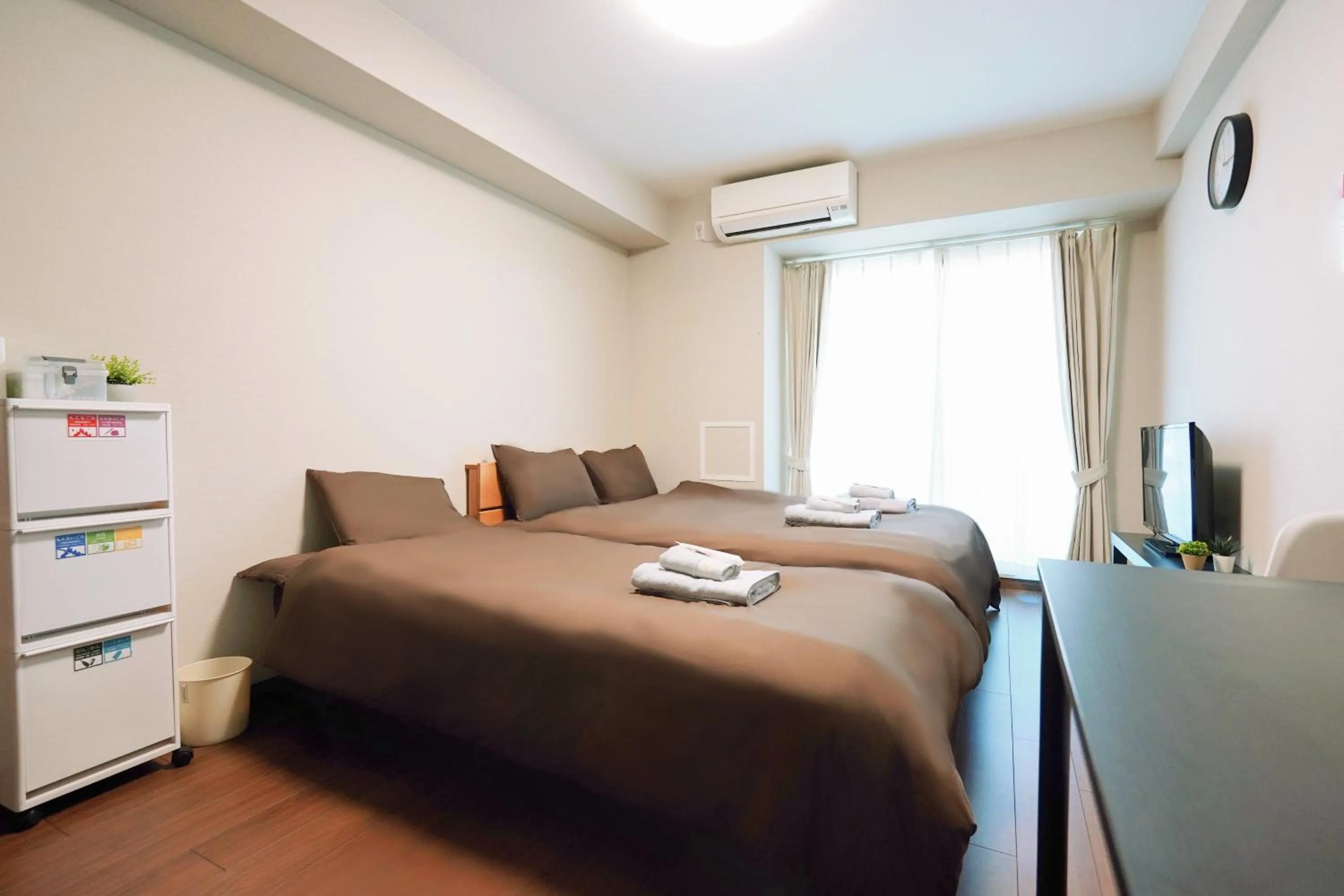 Bed in nestay apartment osaka ebisu