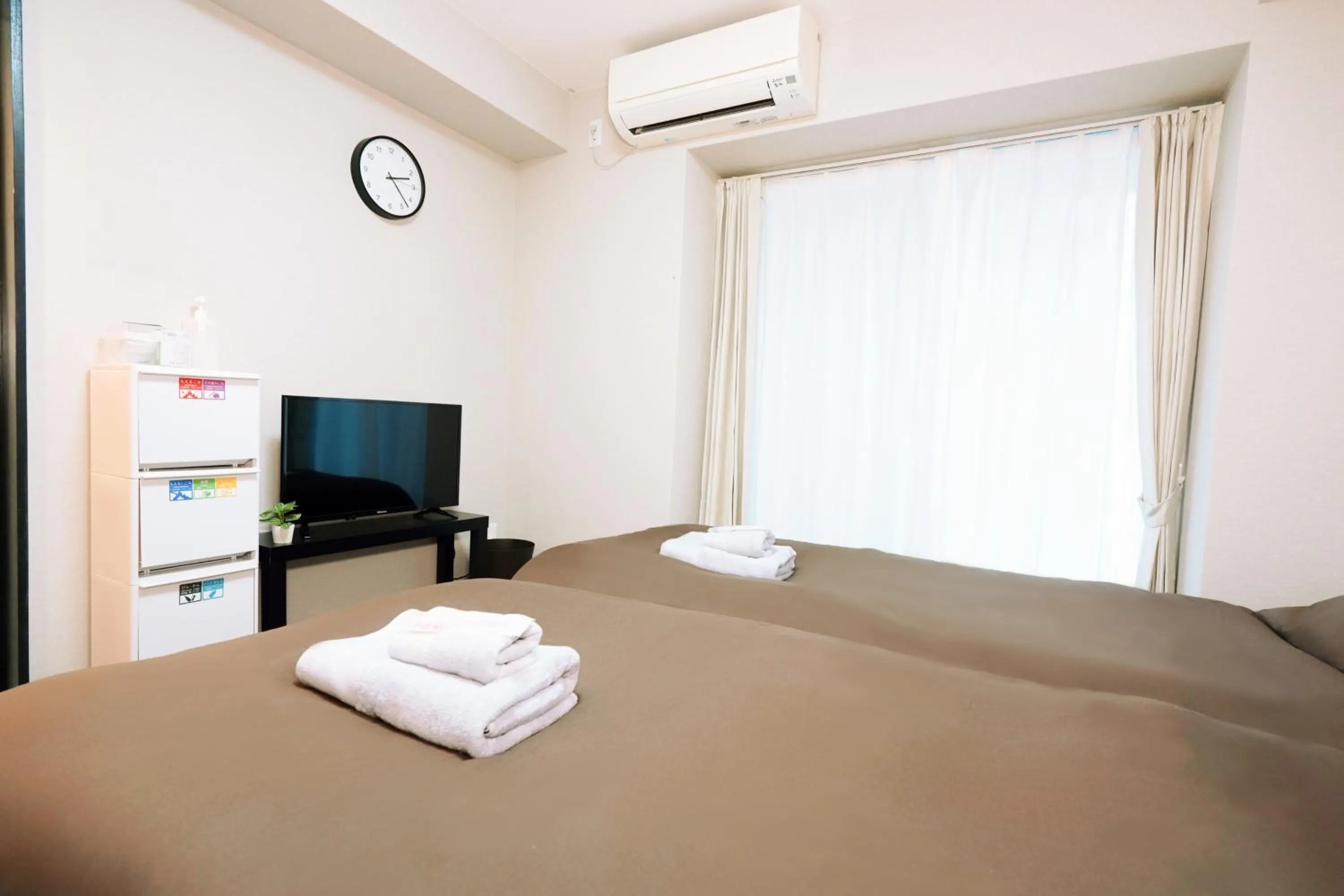 Bed in nestay apartment osaka ebisu