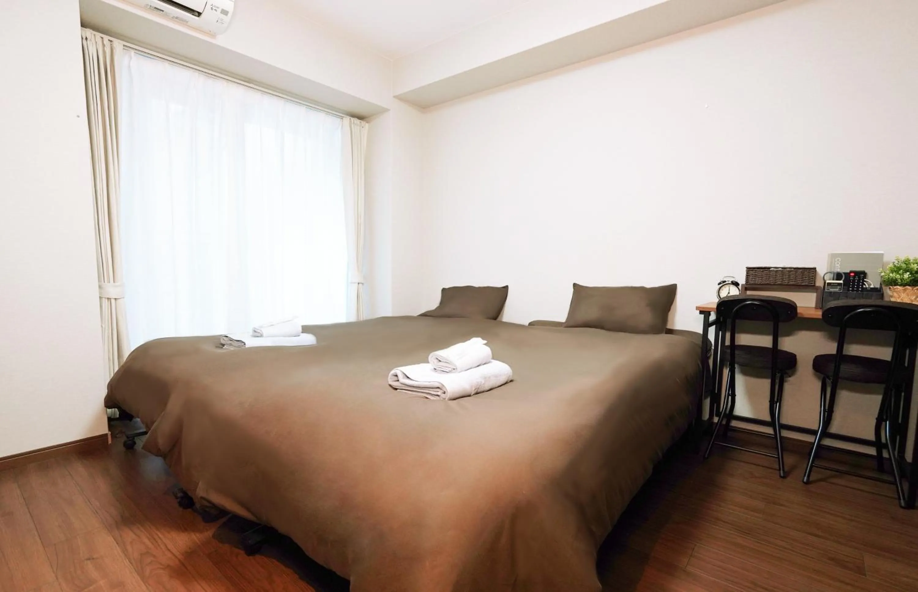 Bed in nestay apartment osaka ebisu