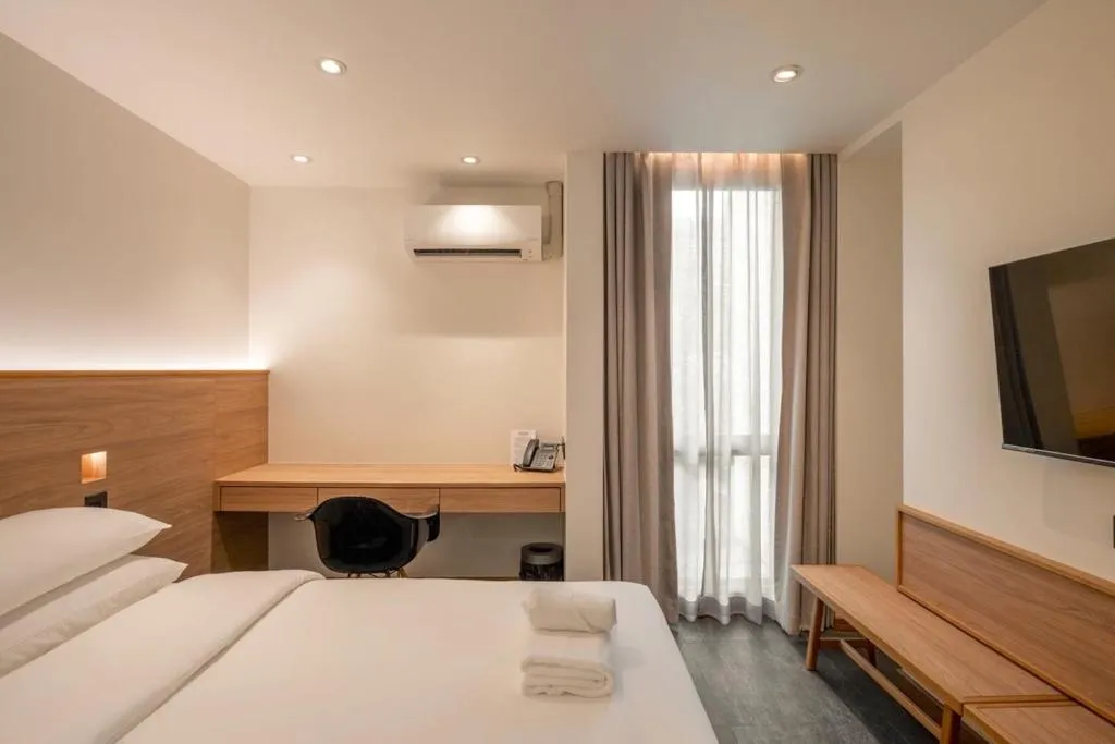 Bed in ZEN MASTER HOTEL