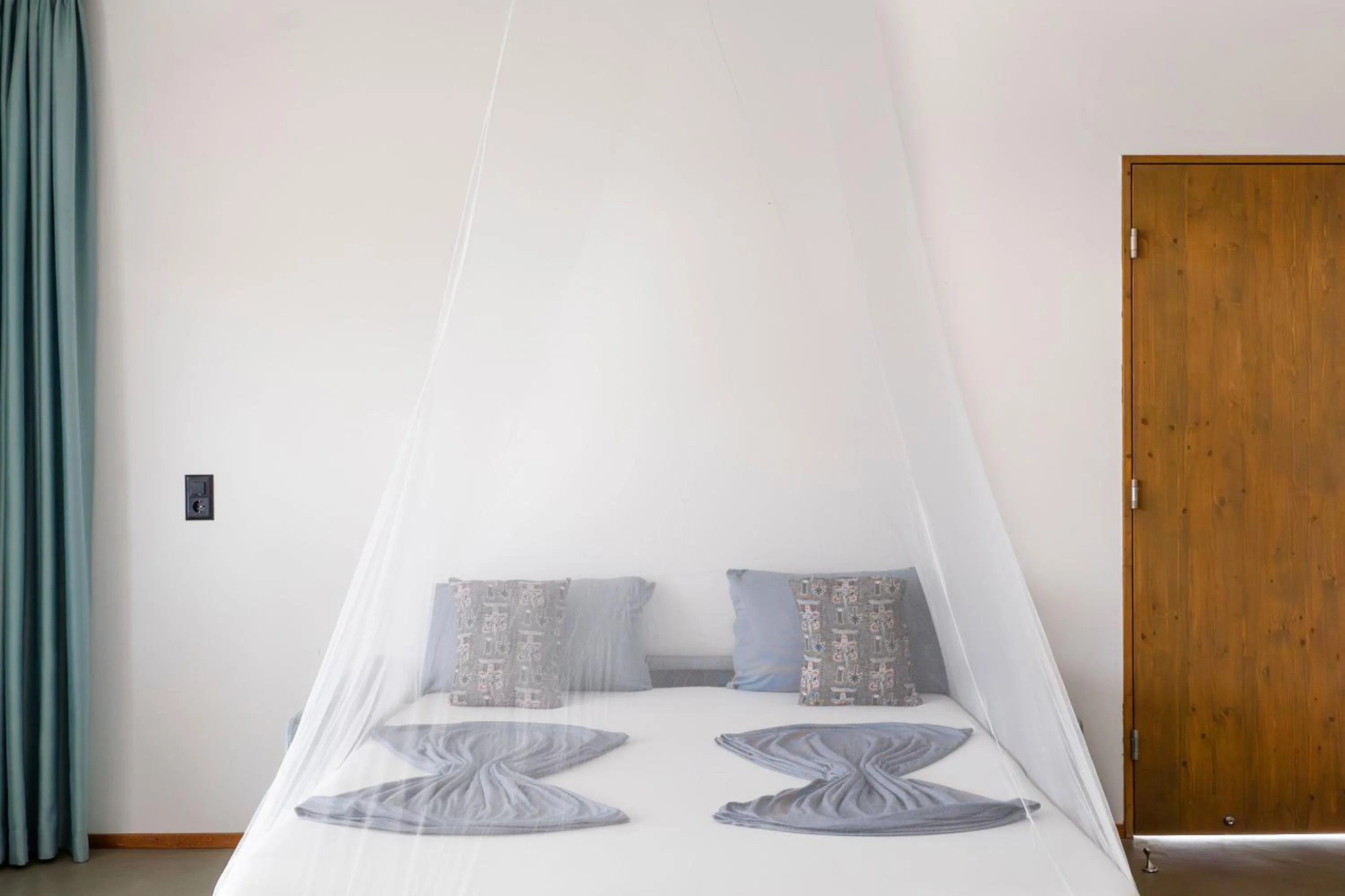 Bed in King Fisher Village Eco-Boutique Hotel