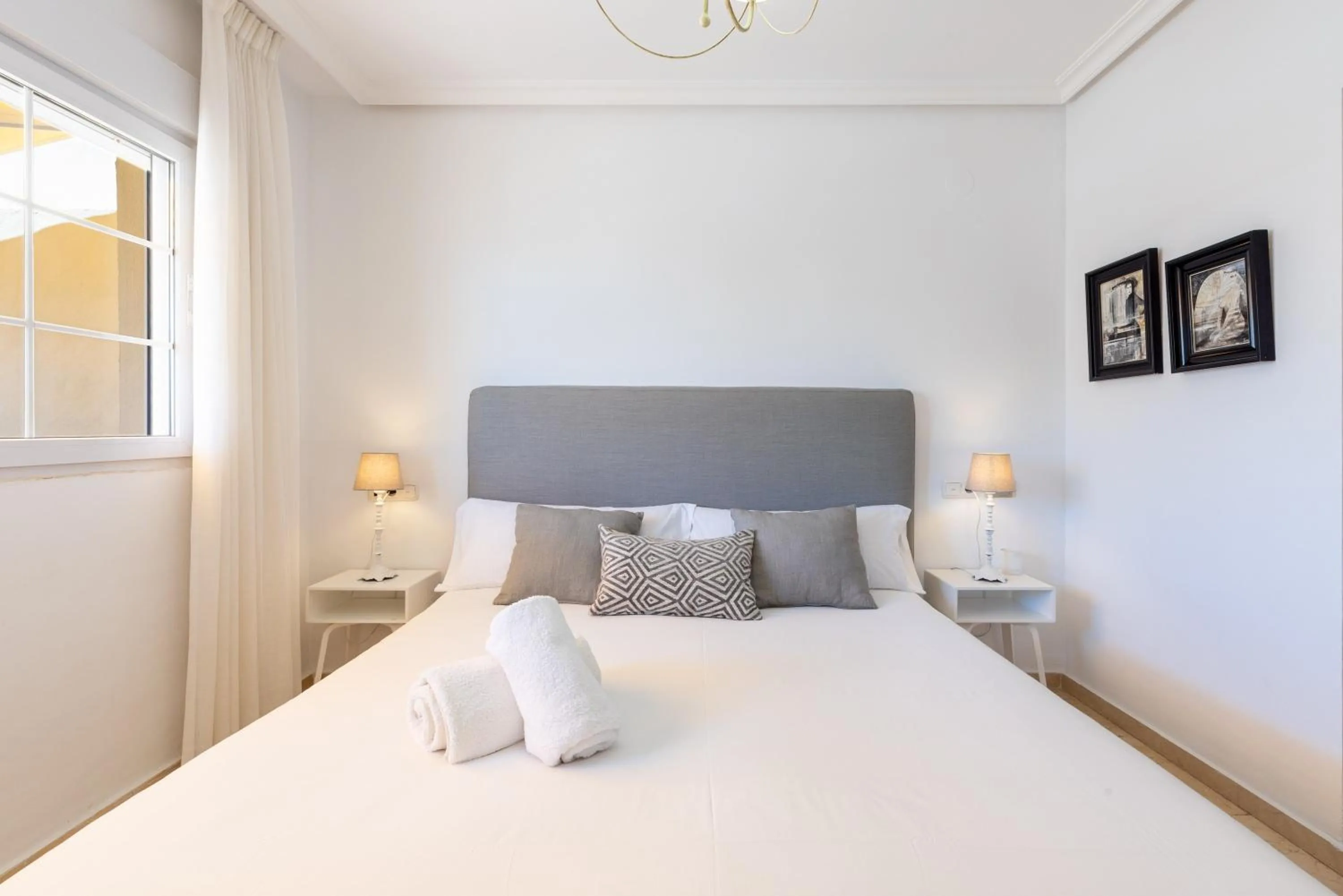 Living room, Bed in Spectacular Penthouse Puente Romano