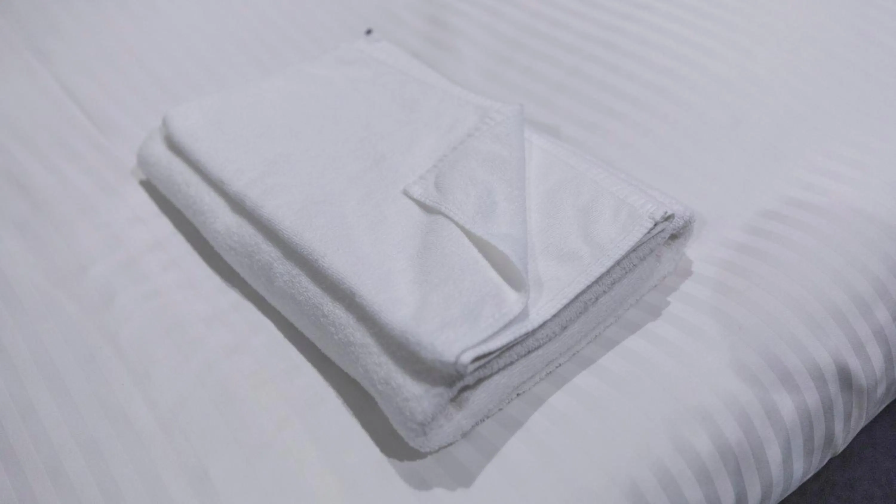 towels, Bed in Tabist OSAKA PORT HOTEL L'ESPOIR