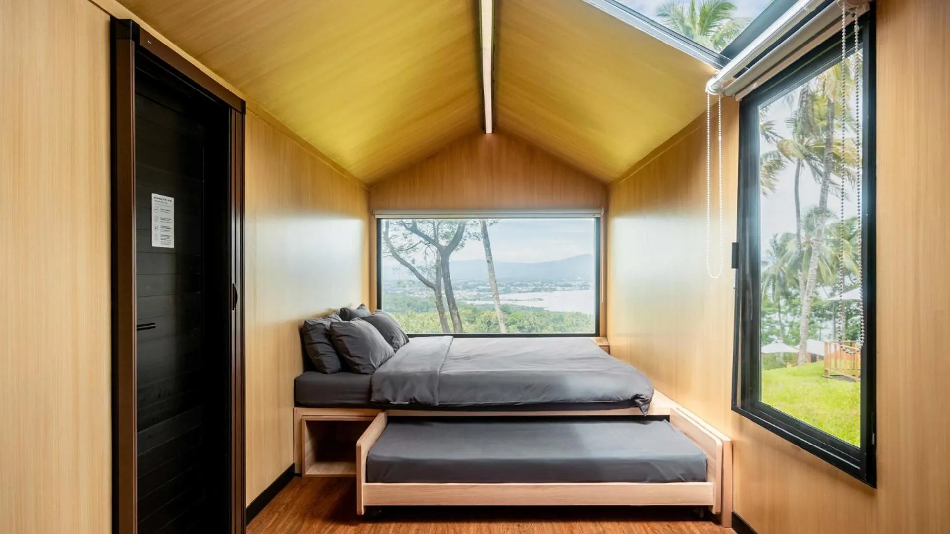 Bed in Bobocabin Bunaken Hills, Manado