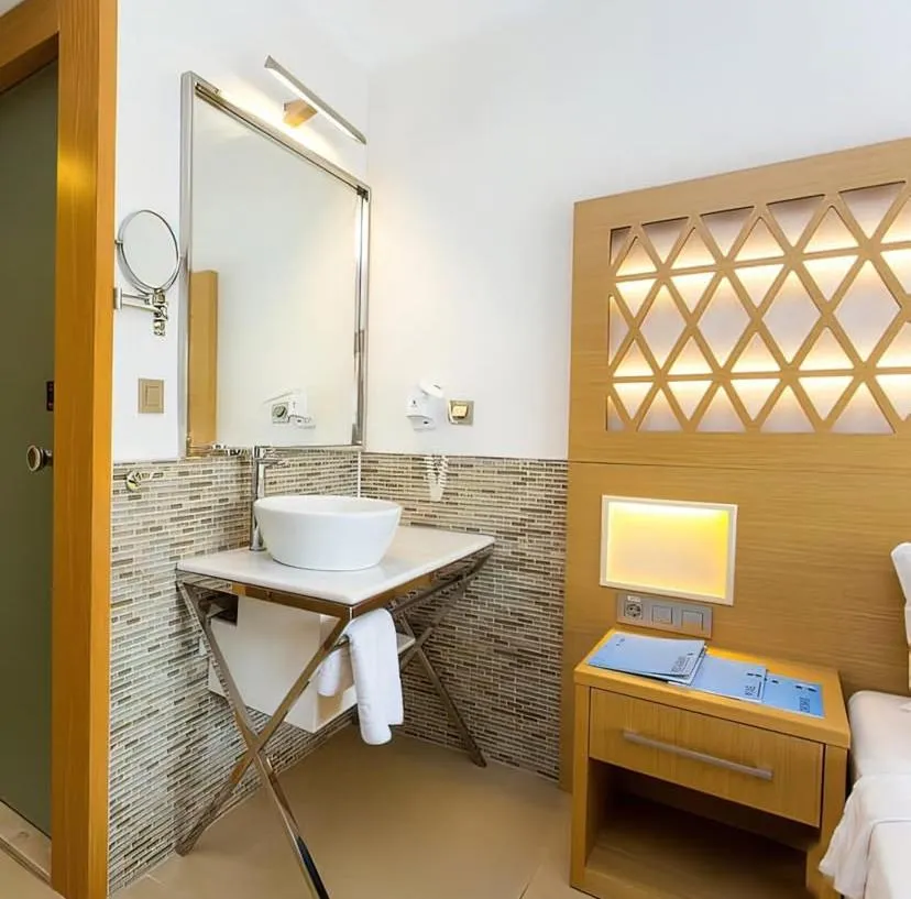 Bed in Aurasia Design Hotel