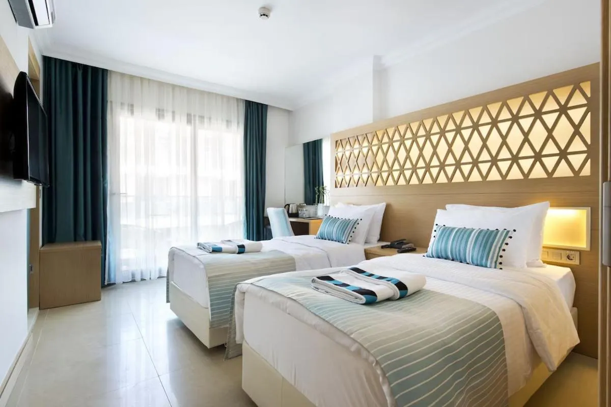 Bed in Aurasia Design Hotel
