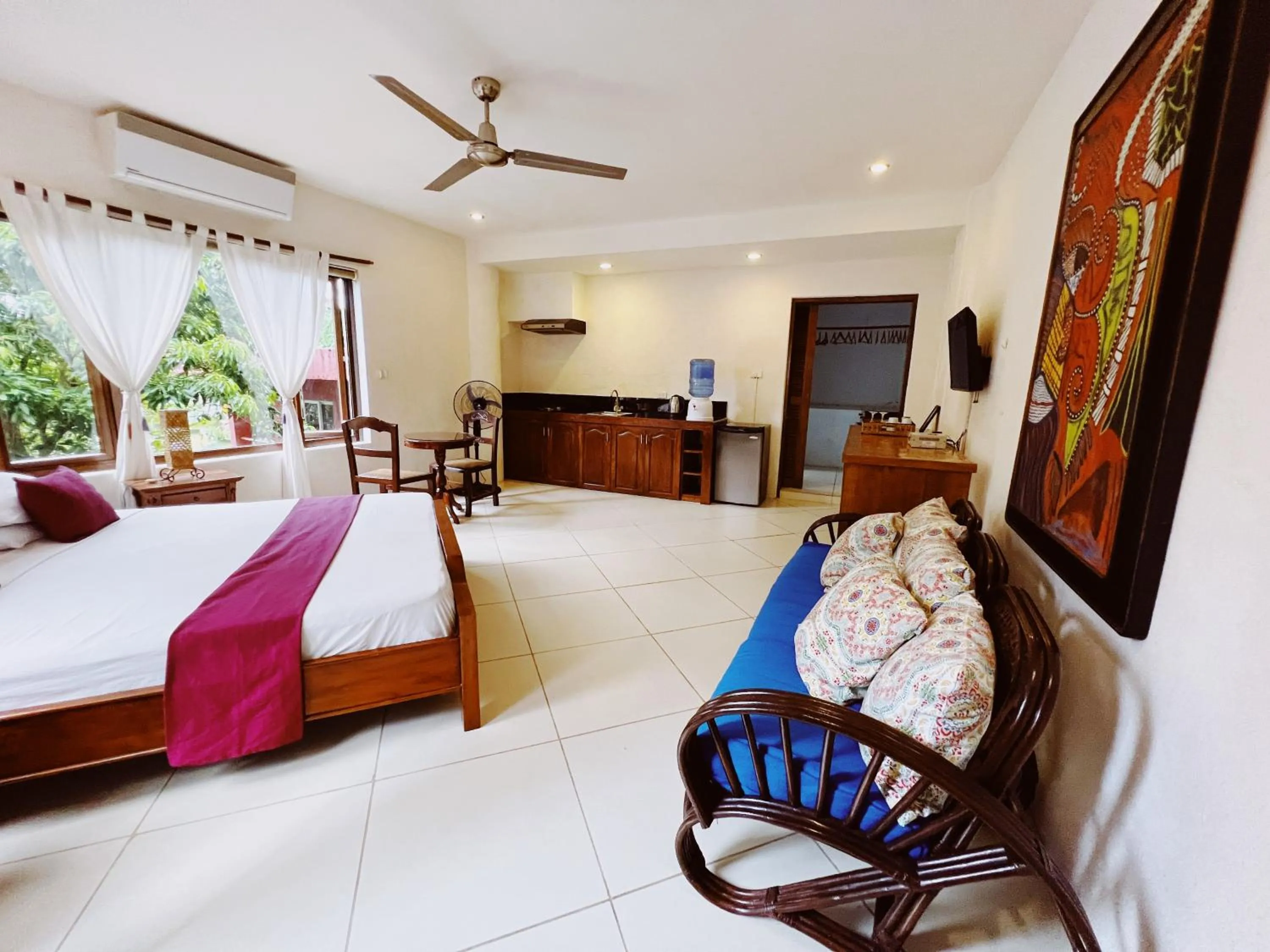 TV and multimedia, Bed in Biancas Garden Apartments Boracay