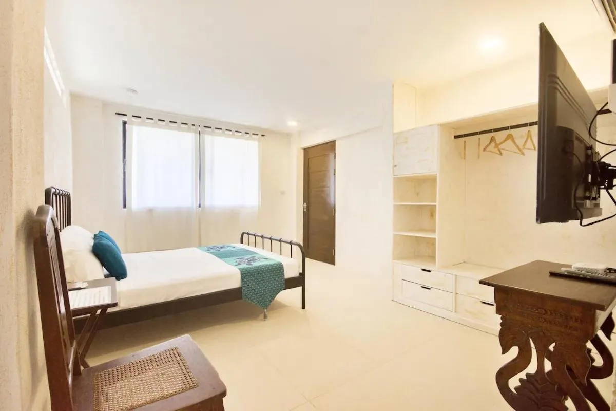 TV and multimedia, Bed in Biancas Garden Apartments Boracay
