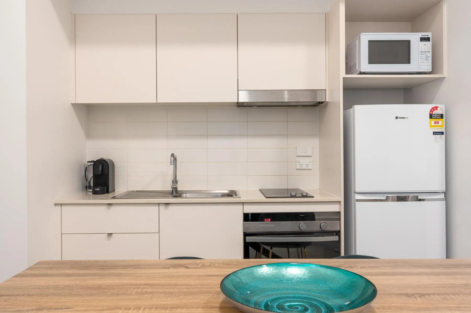 Kitchen or kitchenette in Terminus Apartment Hotel, an Ascend Collection Hotel