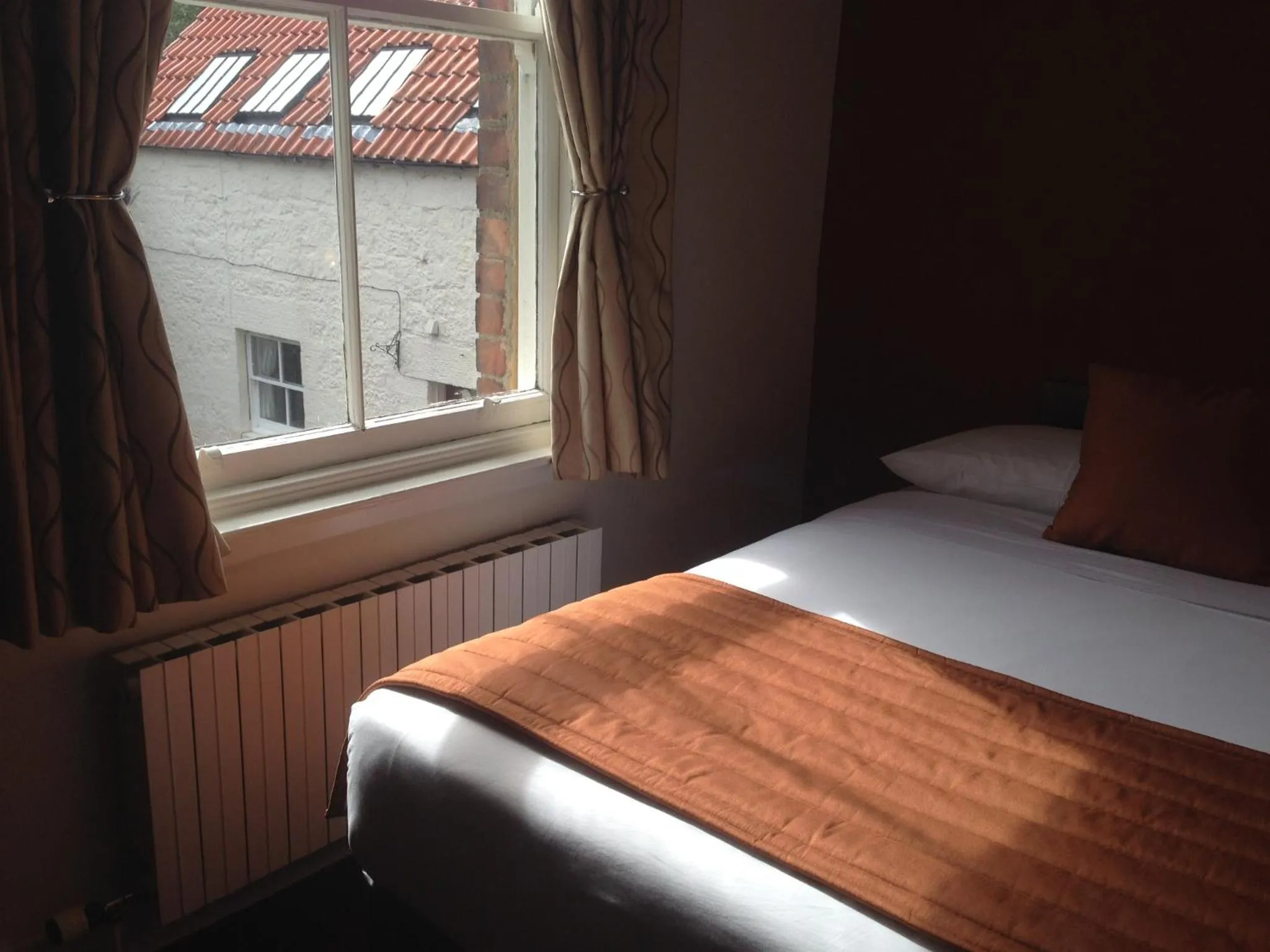 Bed in Aberdour Hotel, Stables Rooms & Beer Garden