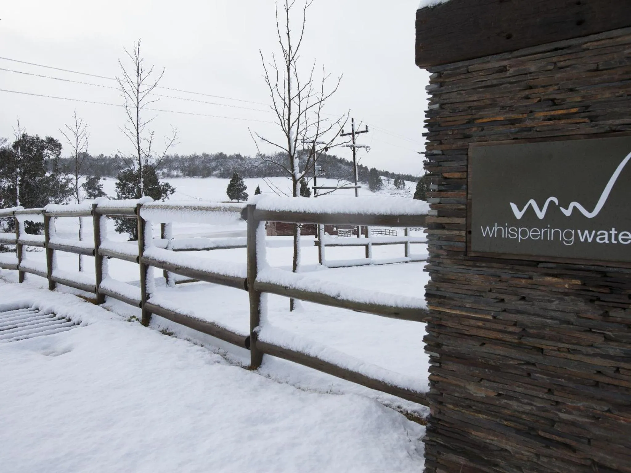 Property logo or sign in Whispering Waters