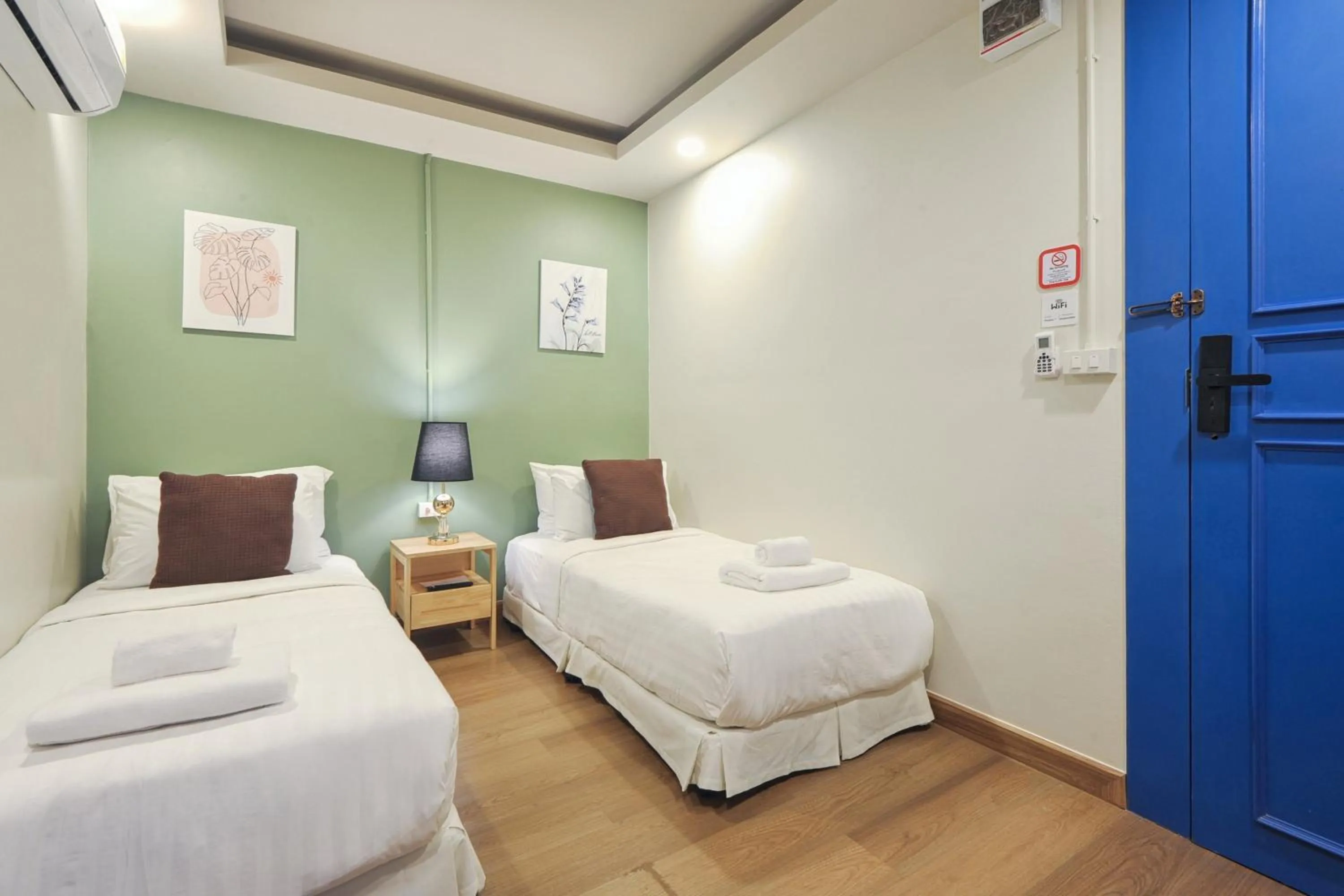 Bed in Ployburi Boutique Hotel